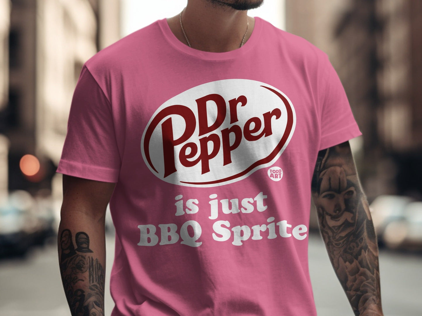 Pink t-shirt with Dr Pepper logo and "is just BBQ Sprite" text.