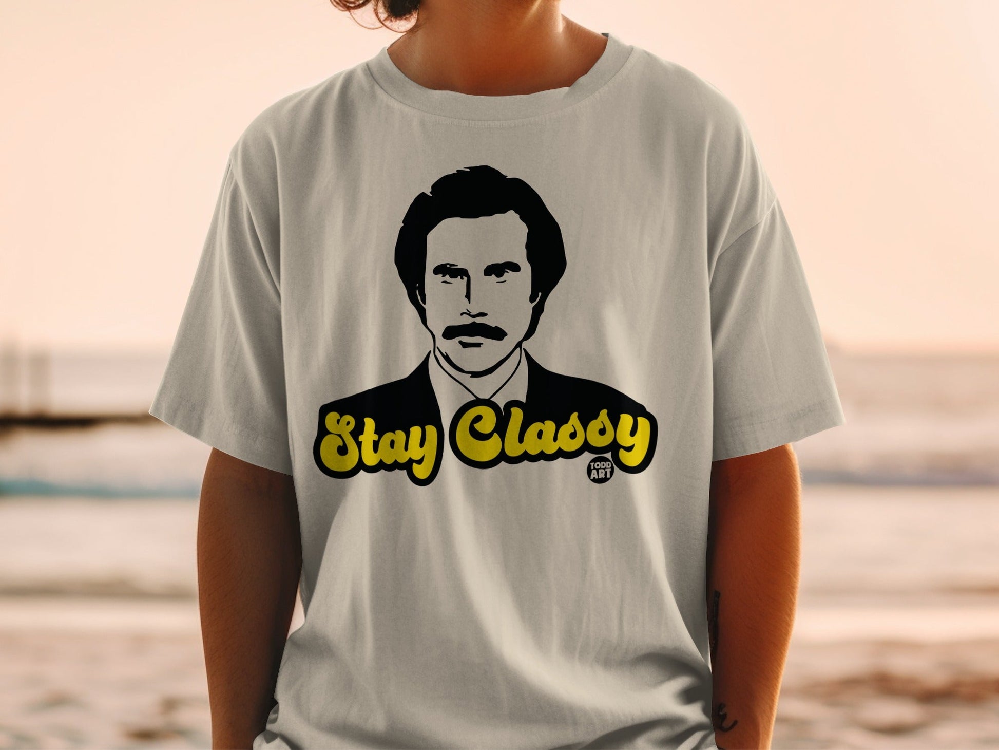 Gray t-shirt with Ron Burgundy's portrait and "Stay Classy" text.