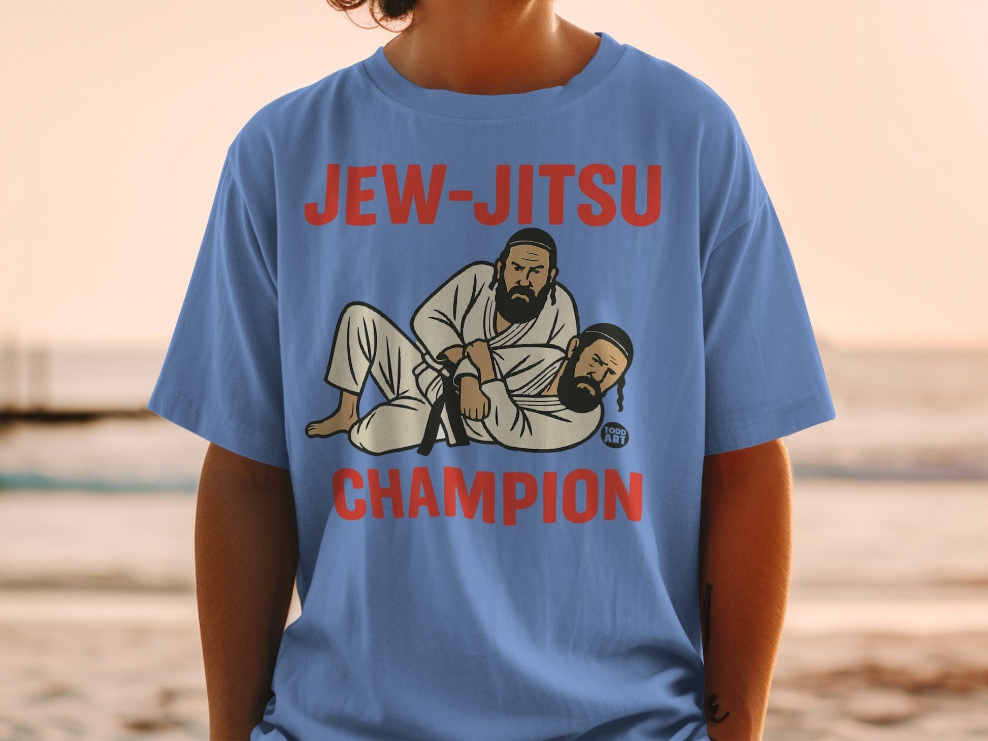 Blue t-shirt with "Jew-Jitsu Champion" and two men in a wrestling hold.
