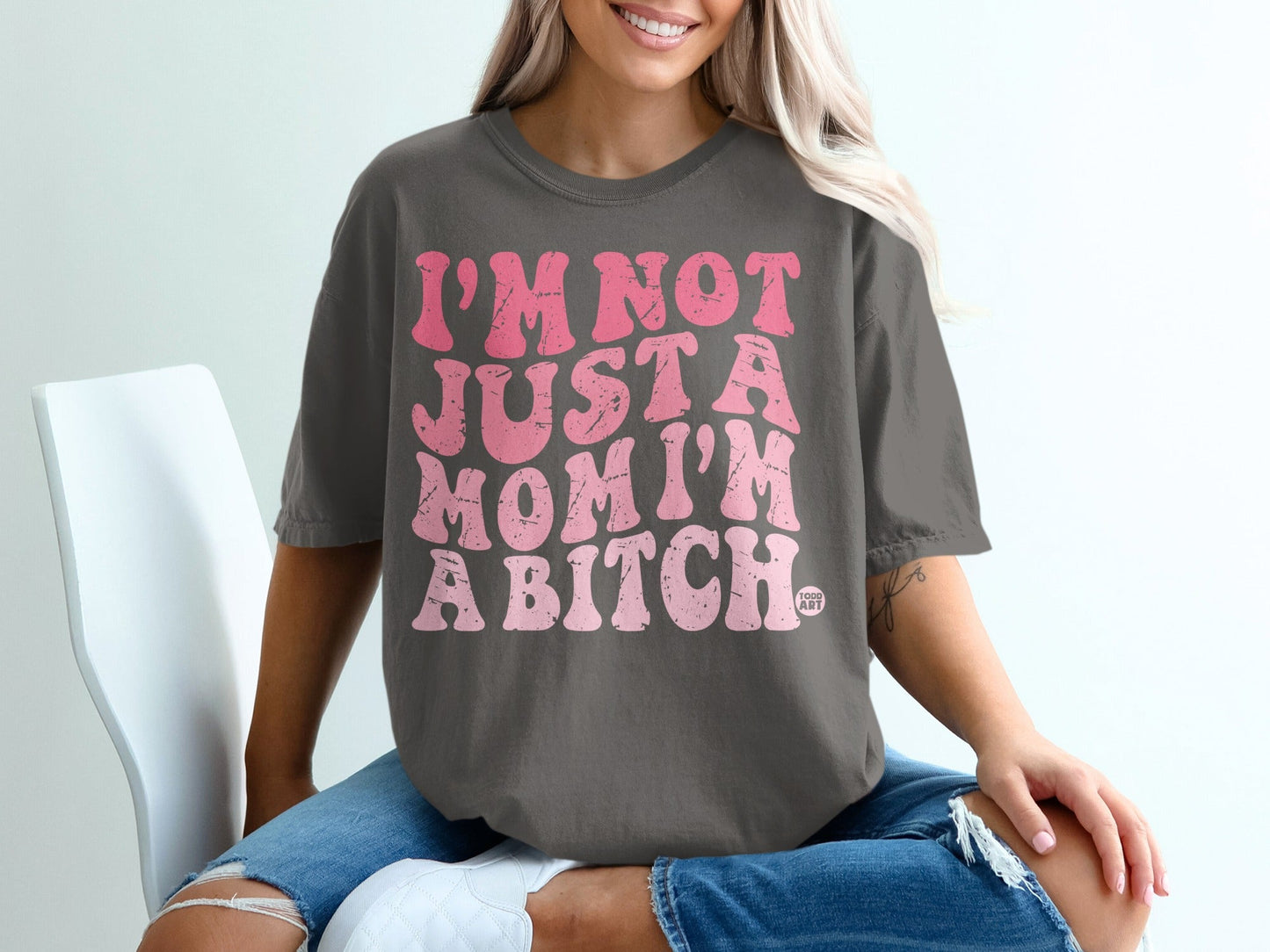 Dark gray t-shirt with pink "I'M NOT JUST A MOM I'M A BITCH" text.