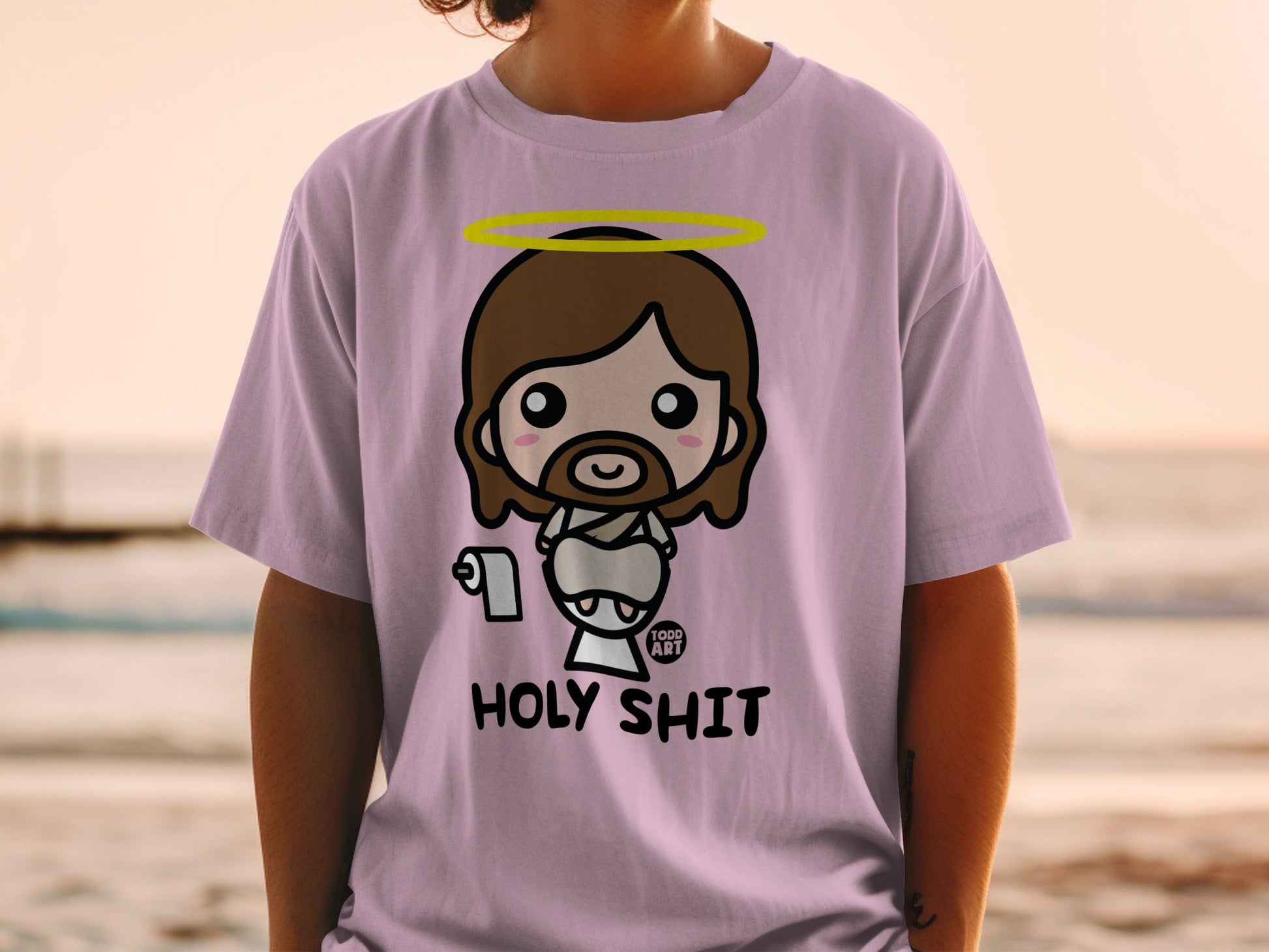 Chibi Jesus with halo on purple t-shirt with "HOLY SHIT" text.
