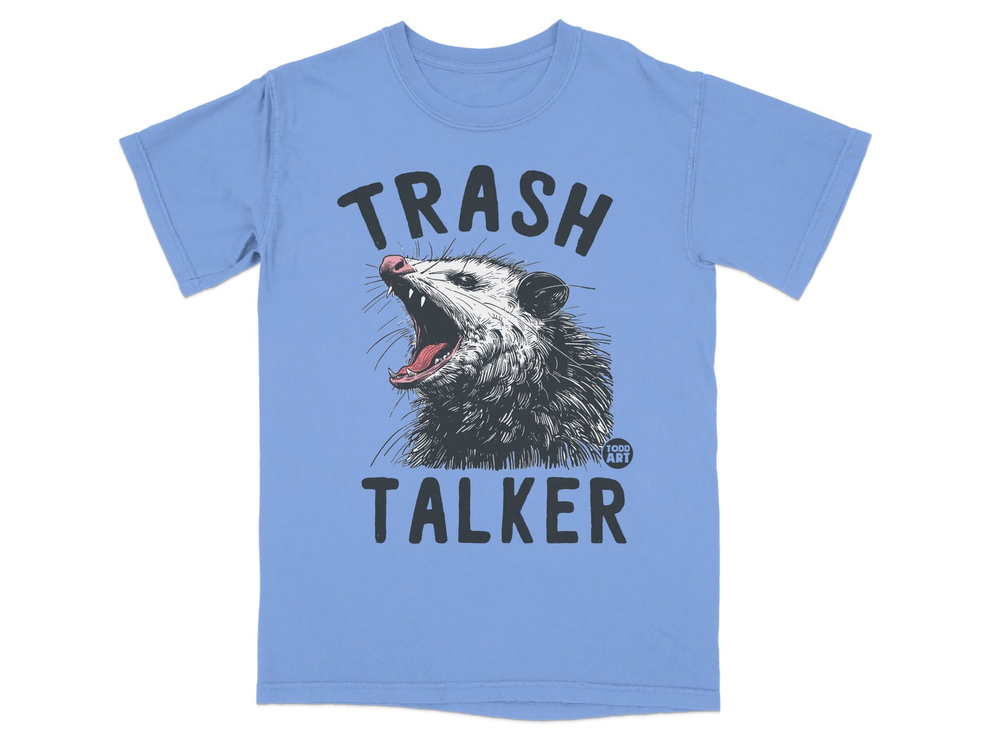 Light blue t-shirt with a graphic of a possum yelling and the text "TRASH TALKER".