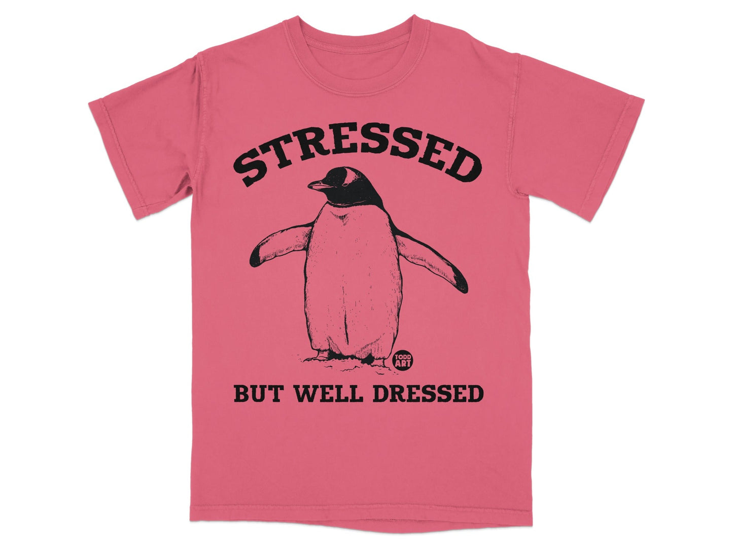 Penguin graphic t-shirt with "STRESSED BUT WELL DRESSED" text.