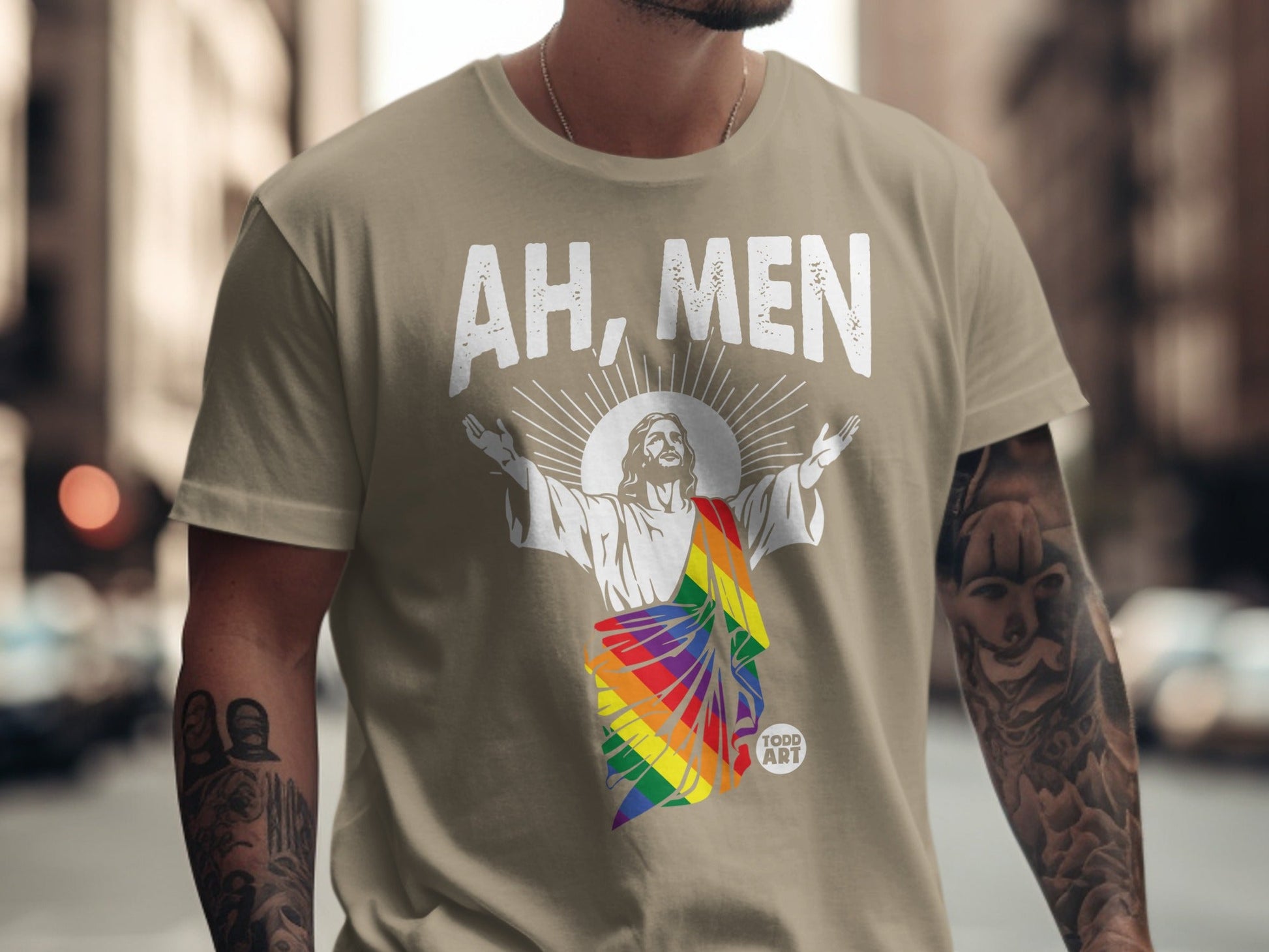 T-shirt with Jesus in rainbow stole, text "AH, MEN" and "TODD ART" logo.