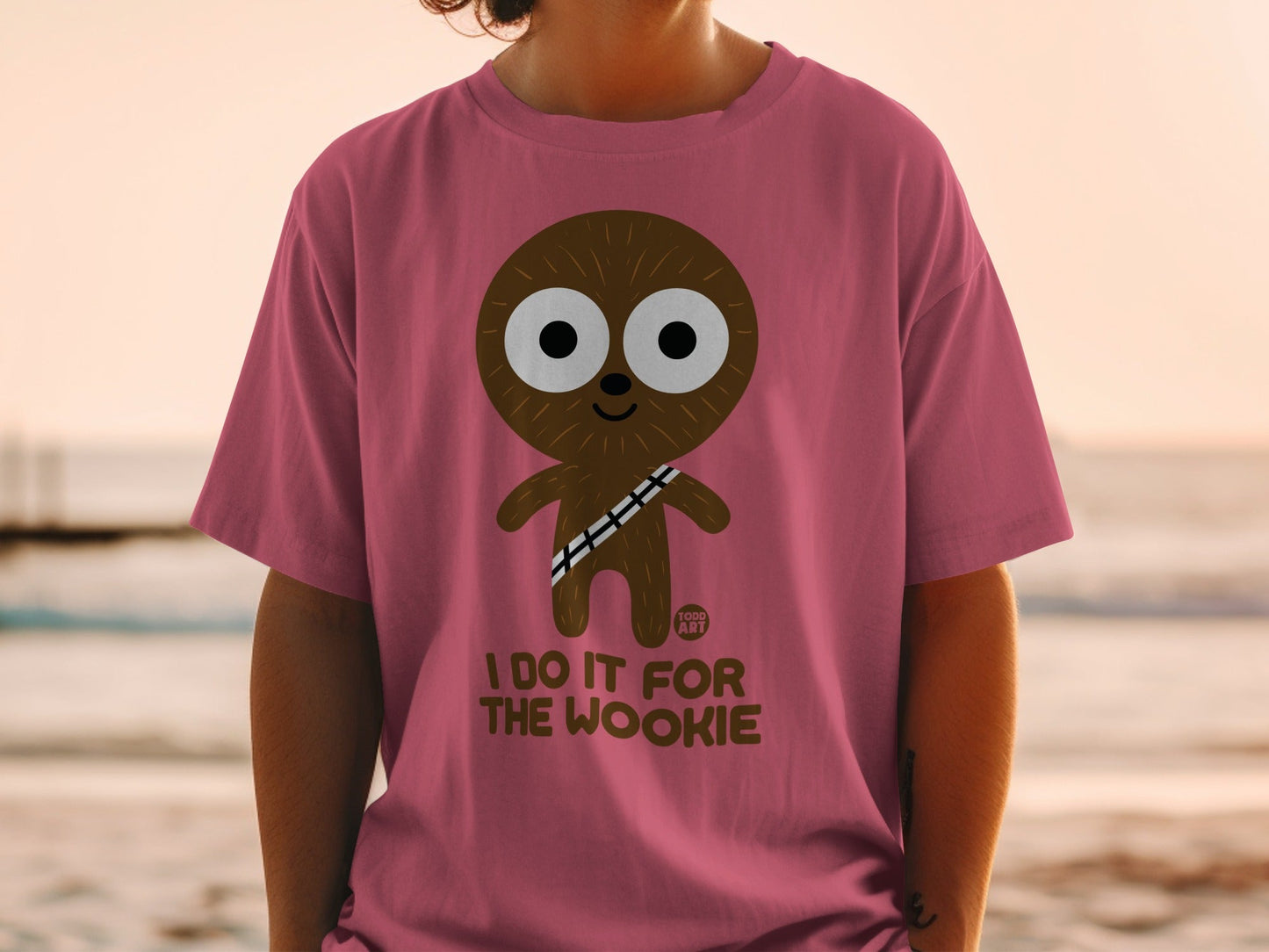 Pink t-shirt with "I DO IT FOR THE WOOKIE" text and a cartoon character.