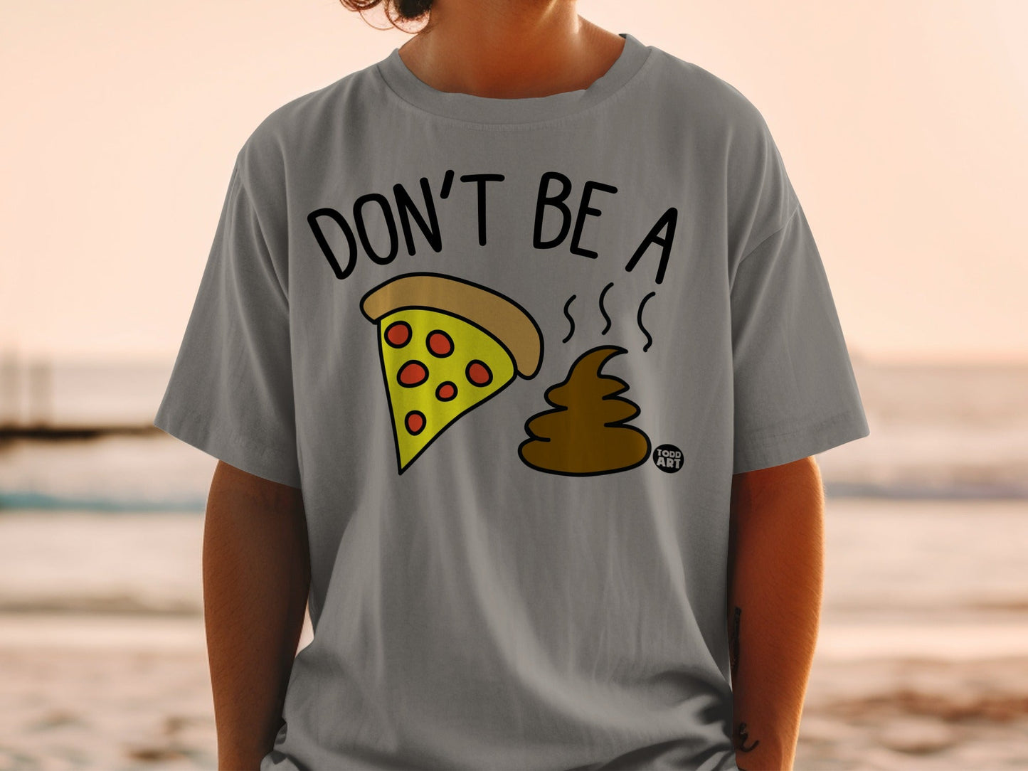 Gray t-shirt with "DON'T BE A" and pizza slice next to poop emoji.