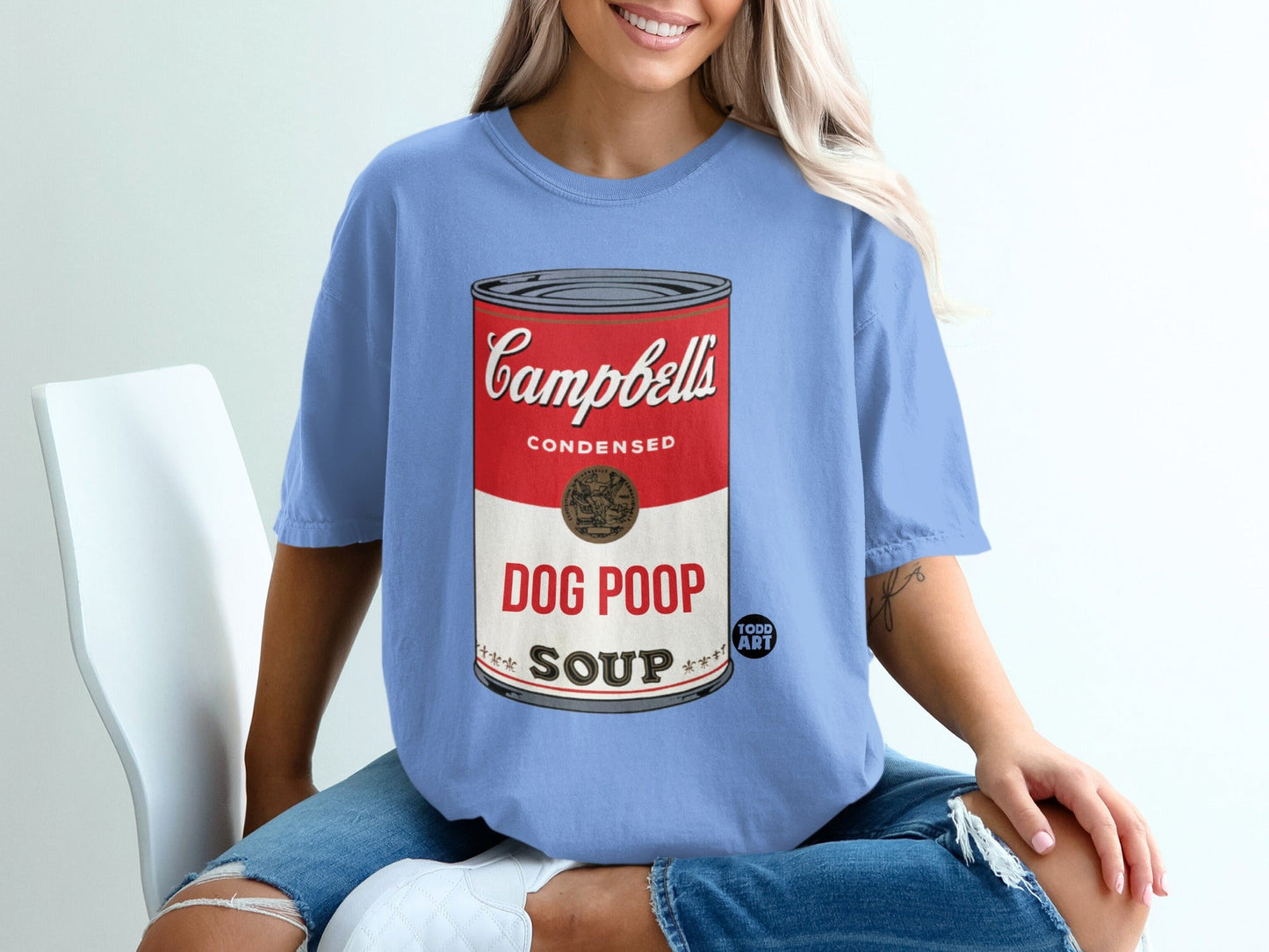 Campbell's Condensed Dog Poop Soup can design on a blue t-shirt.