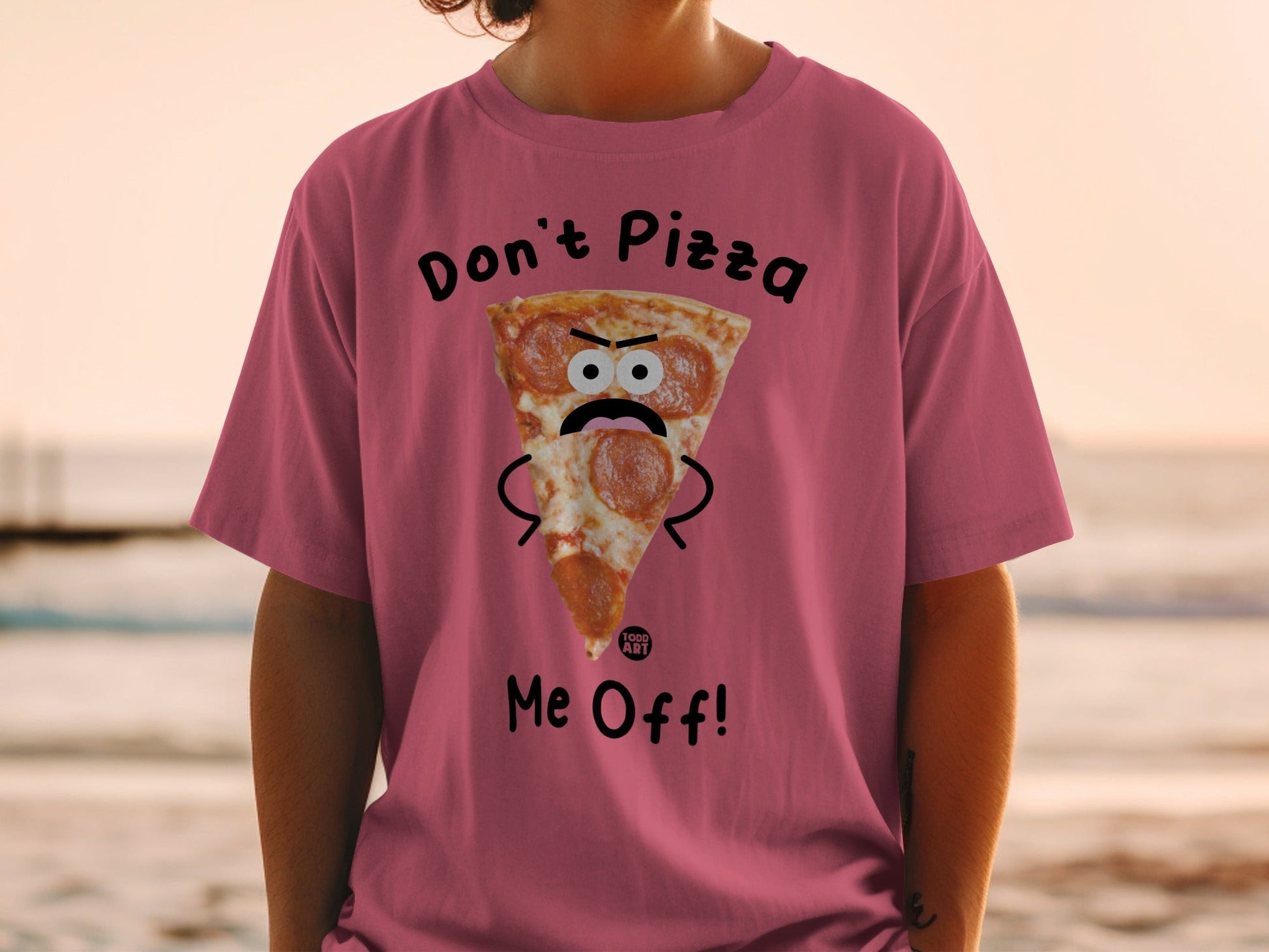Pink t-shirt with a sad pizza slice and "Don't Pizza Me Off!" text.