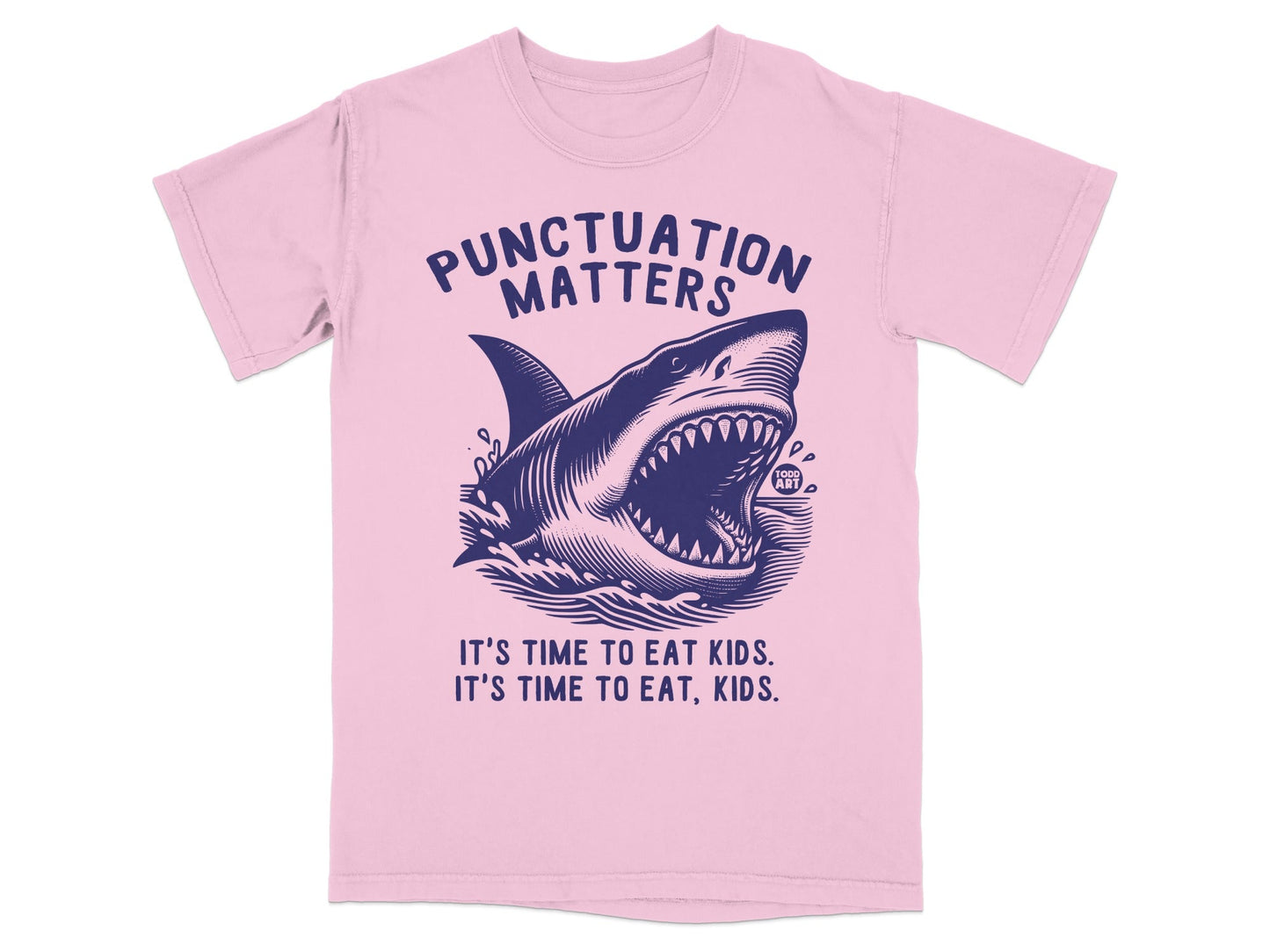 Pink t-shirt with a dark blue graphic of a shark and text reading "Punctuation Matters."
