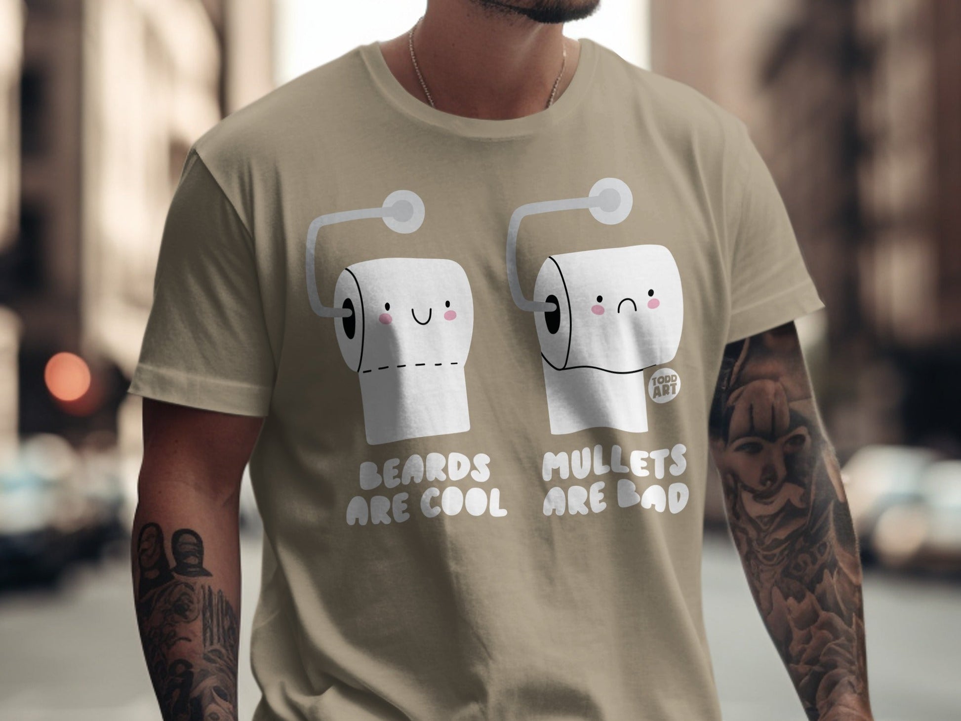 Two toilet paper rolls with faces, one happy, one sad, on a tan t-shirt.
