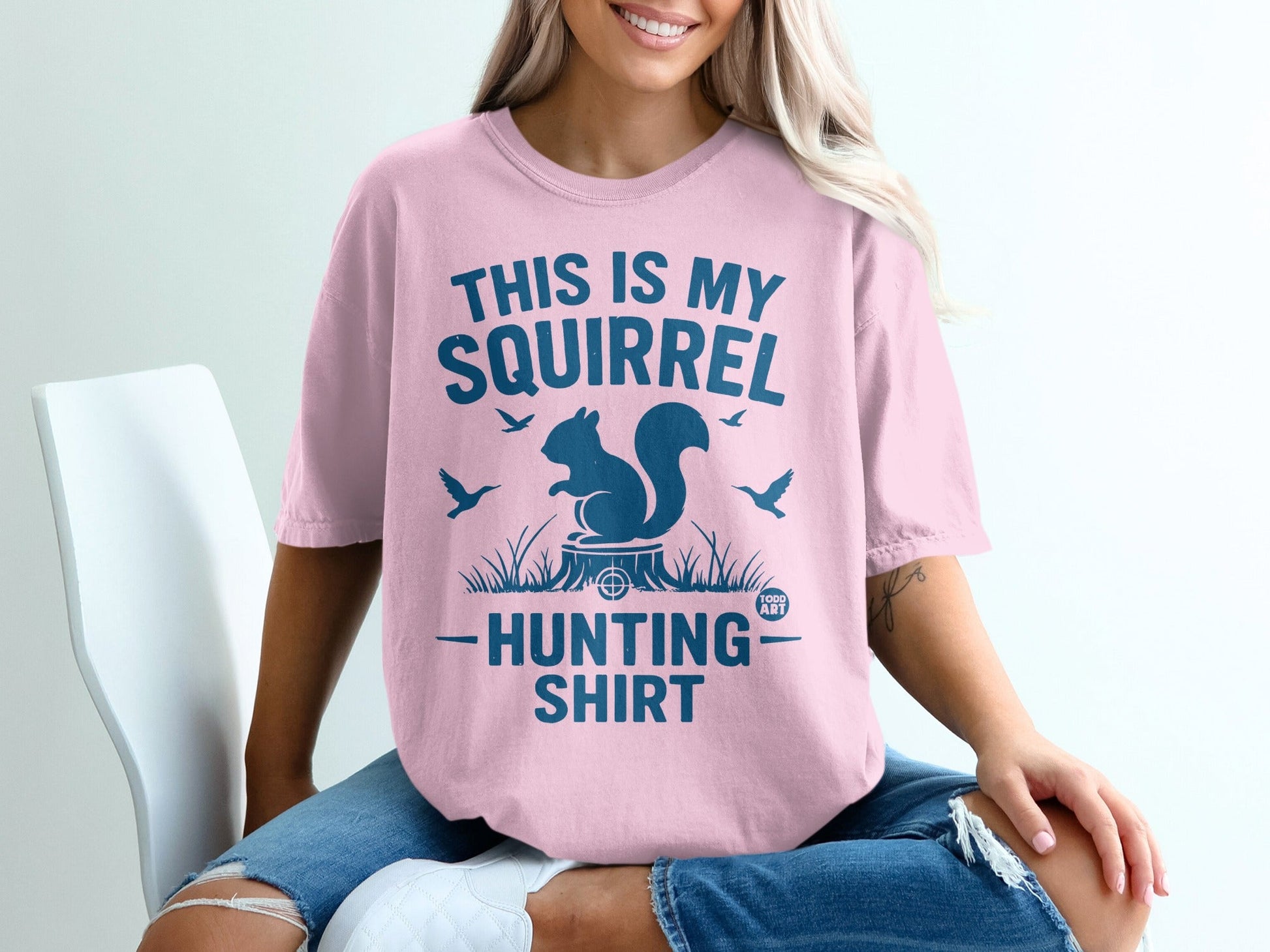 Pink t-shirt with "THIS IS MY SQUIRREL HUNTING SHIRT" text and squirrel graphic.