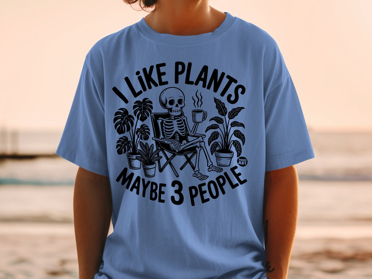 Skeleton sitting in chair surrounded by plants holding a mug, text "I like plants maybe 3 people".