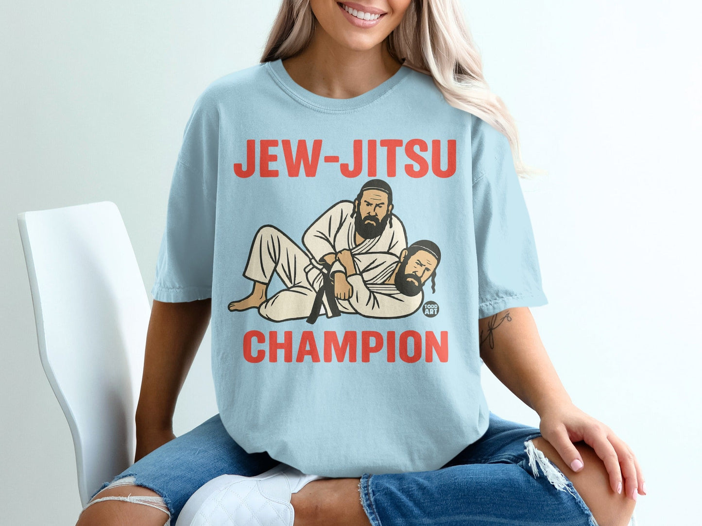 Light blue t-shirt with "JEW-JITSU CHAMPION" in red lettering.
