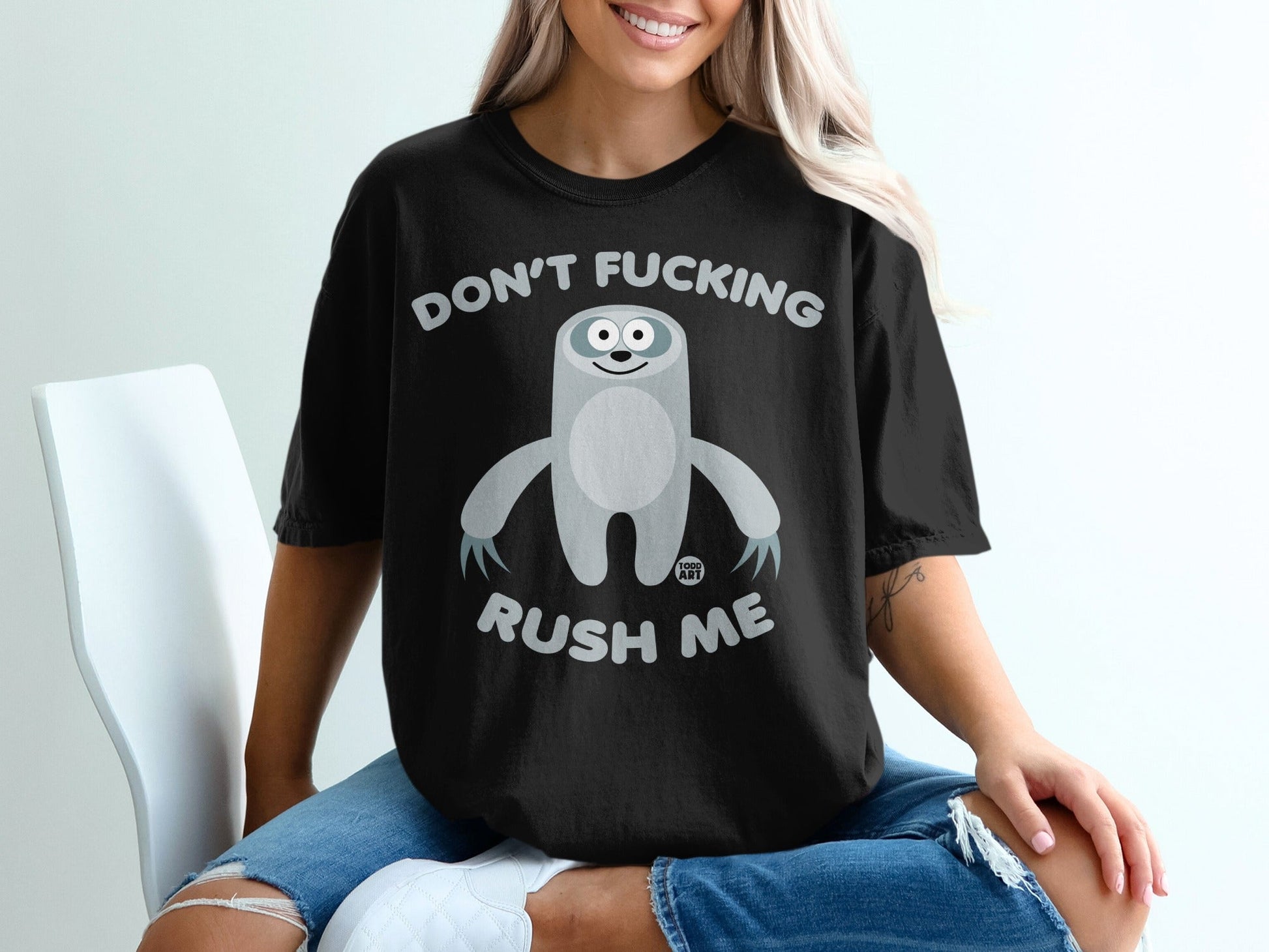 Black t-shirt with a sloth graphic and text that reads "Don't Fucking Rush Me".