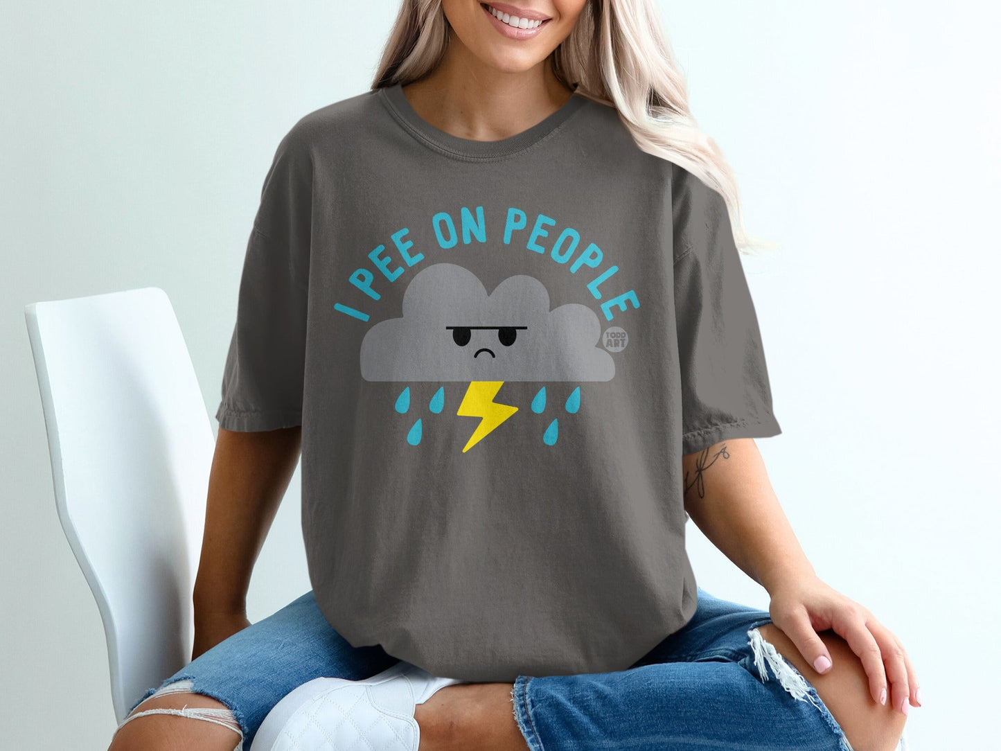 Grey t-shirt with a cartoon cloud, lightning bolt, and "I pee on people" text.