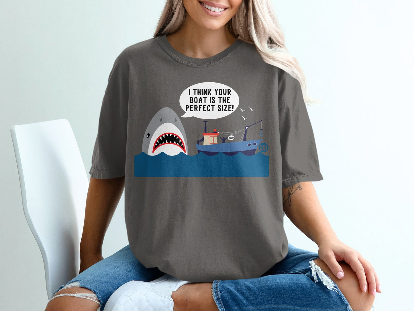 Shark attacking fishing boat with text "I think your the perfect size!"