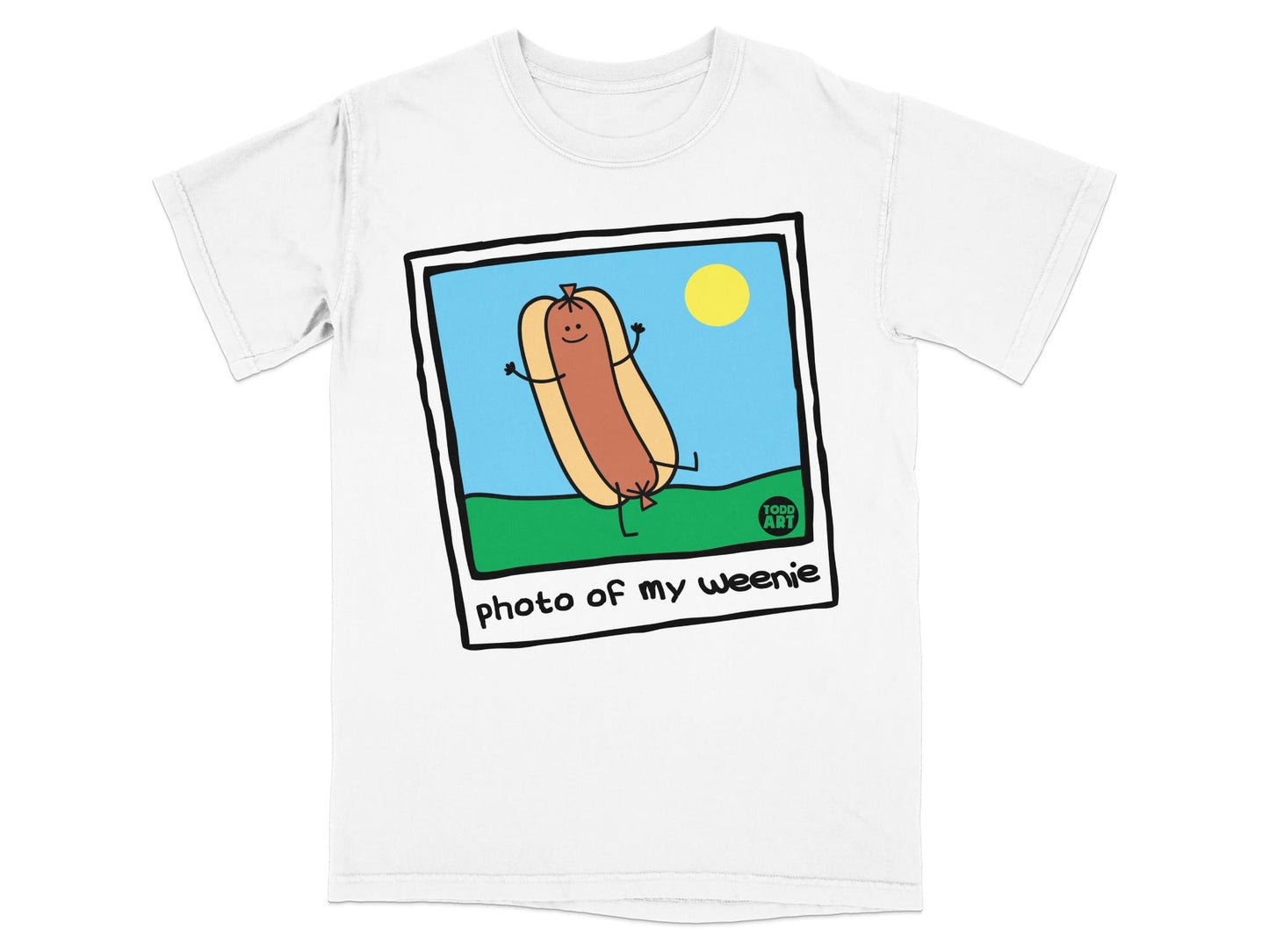 Cartoon hot dog with arms and legs, smiling, on grass.