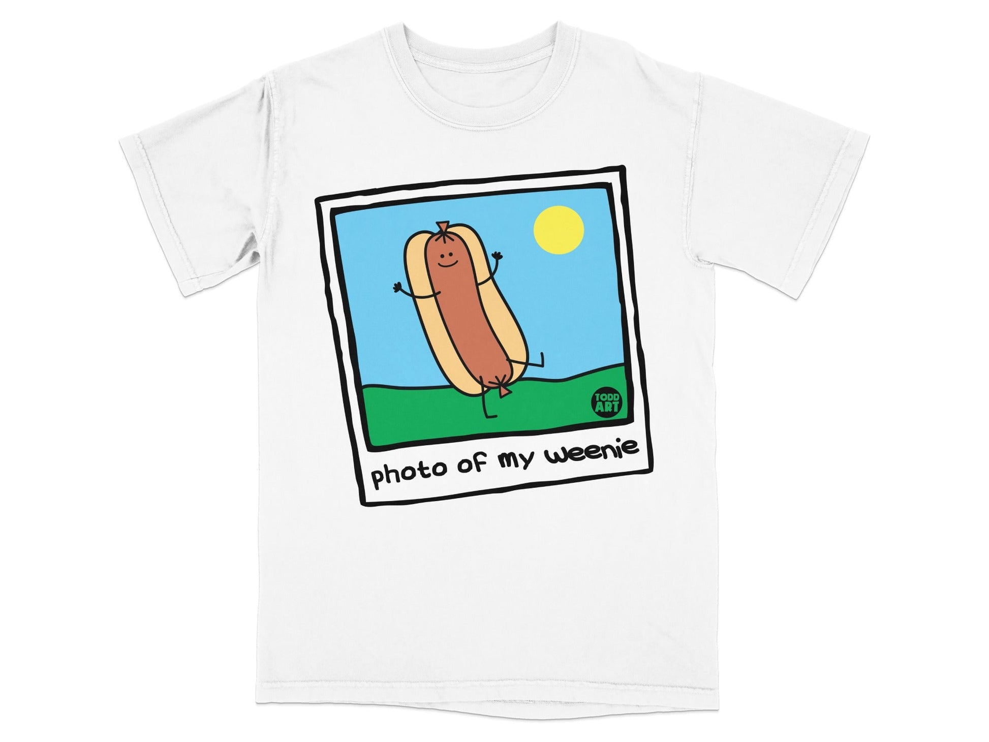 Cartoon hot dog with arms and legs, smiling, on grass.