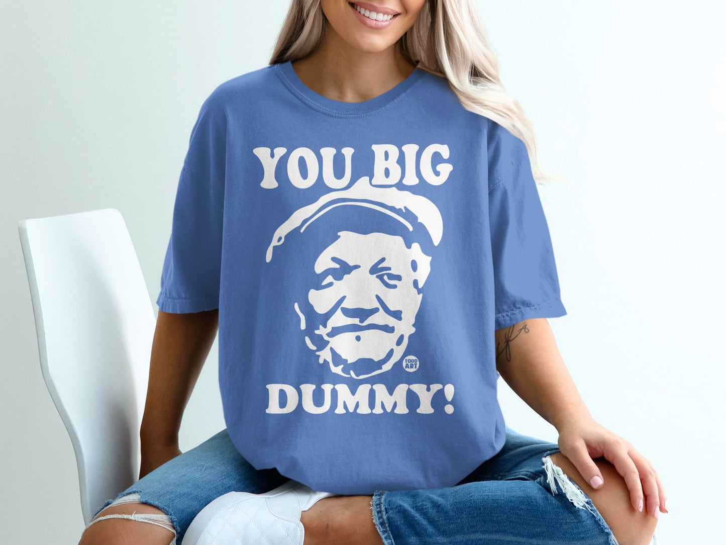 Blue t-shirt with "YOU BIG DUMMY!" and a portrait graphic.