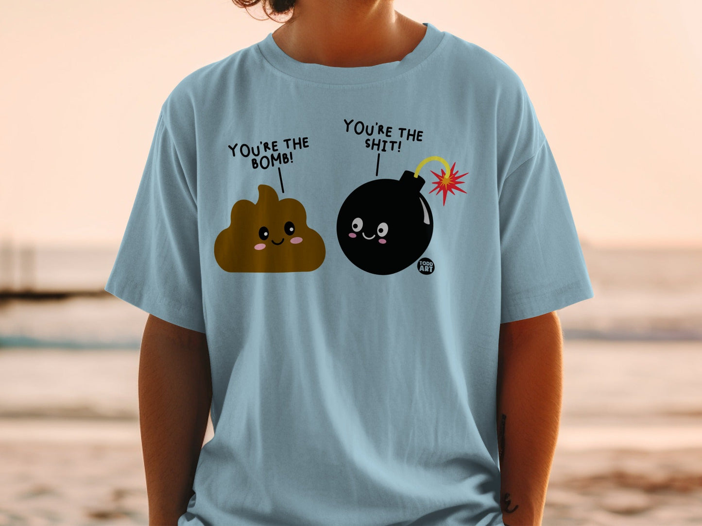 Light blue t-shirt with poop and bomb emojis, saying "You're the bomb!"