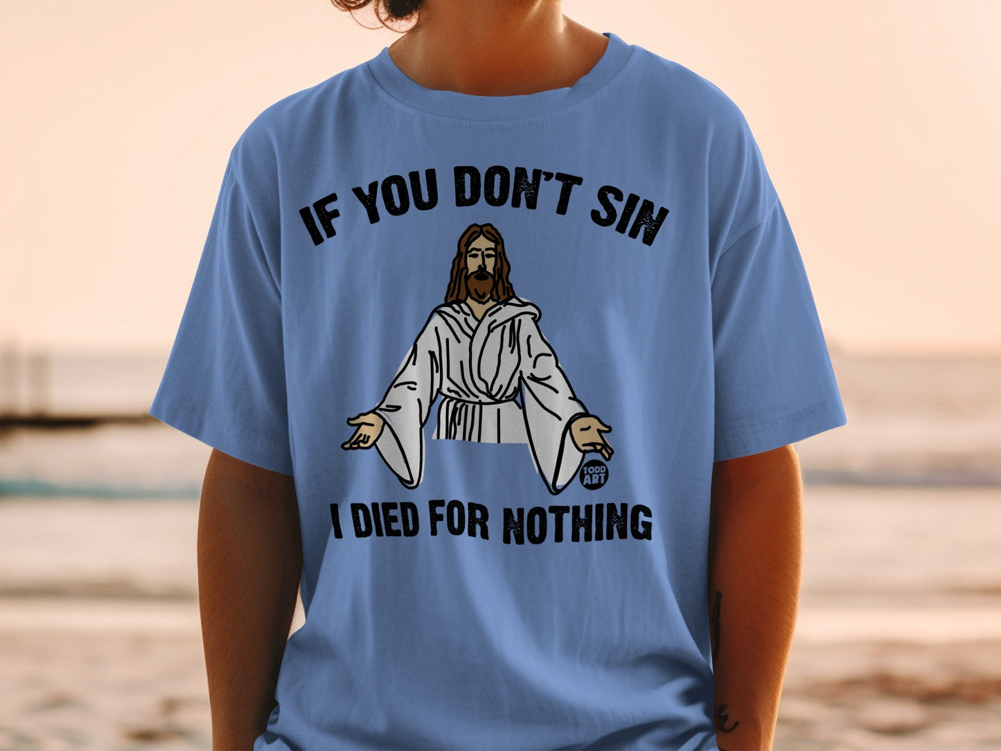 Blue t-shirt with "IF YOU DON'T SIN I DIED FOR NOTHING" and Jesus graphic.