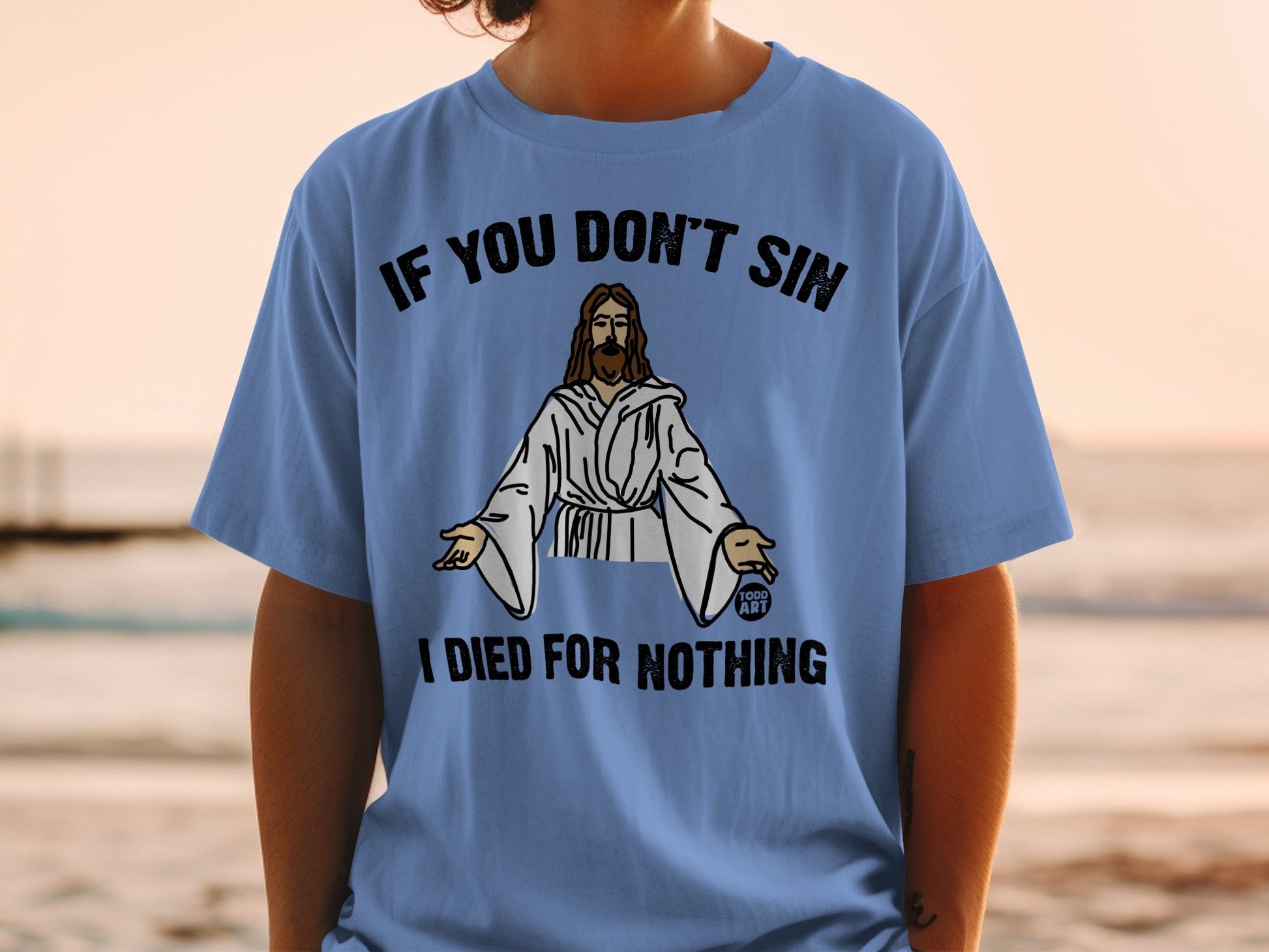 Blue t-shirt with "IF YOU DON'T SIN I DIED FOR NOTHING" and Jesus graphic.