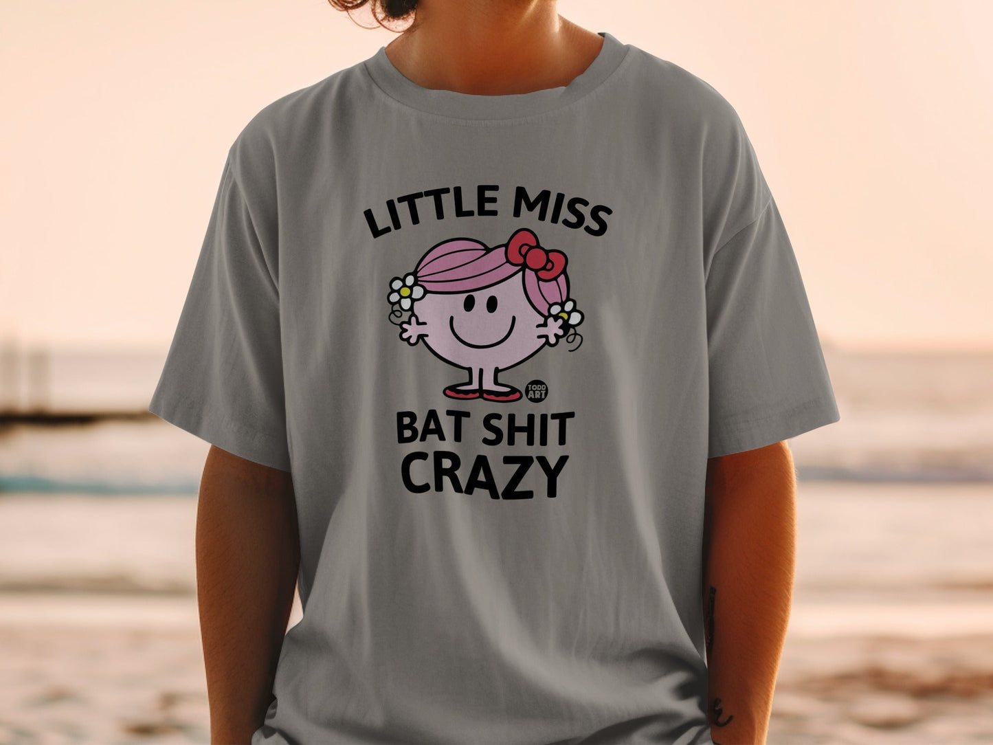 T-shirt with "Little Miss Bat Shit Crazy" text and cartoon character.
