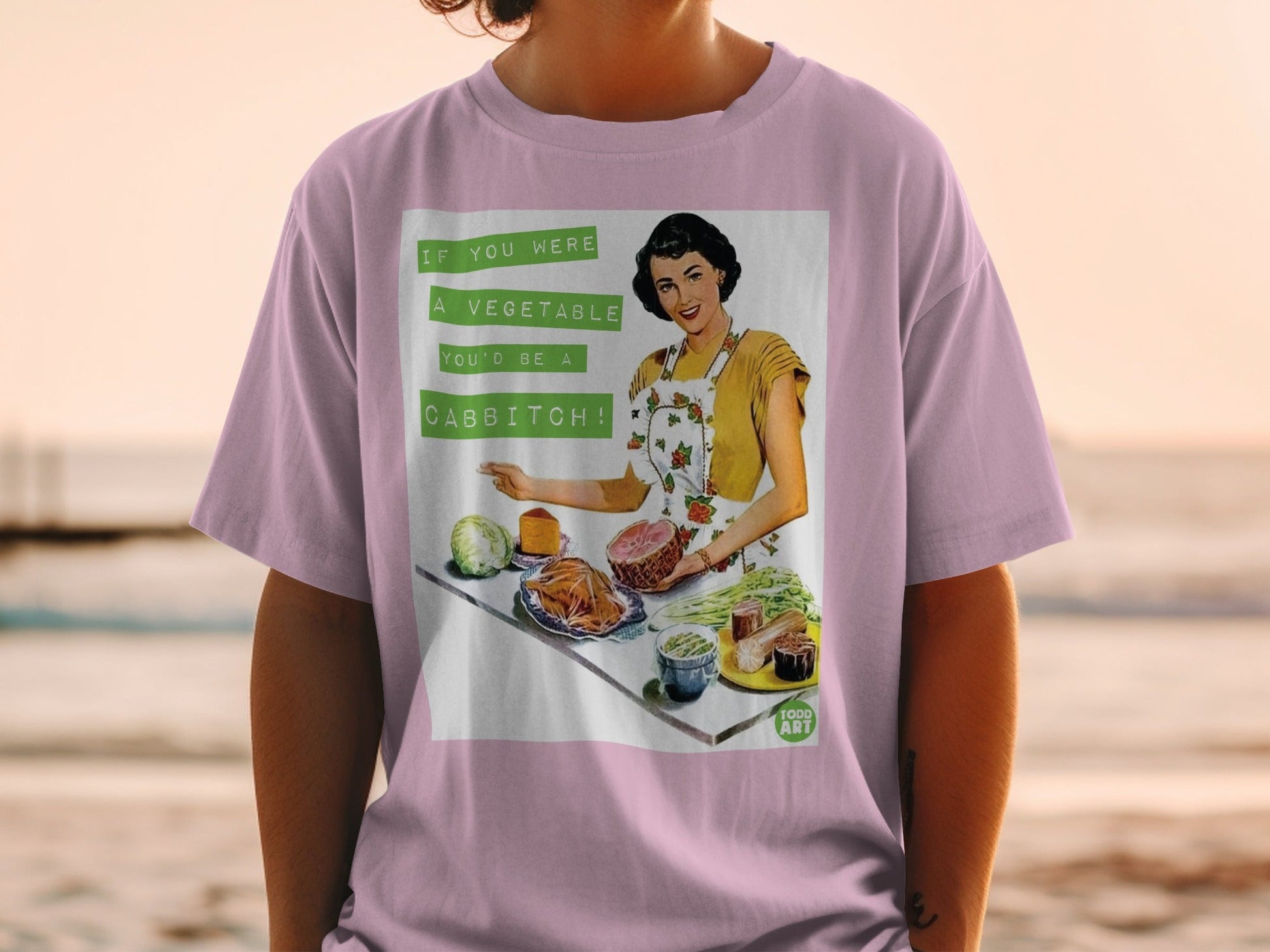 T-shirt with retro illustration of woman and text "If you were a vegetable you'd be a cabbitch!"
