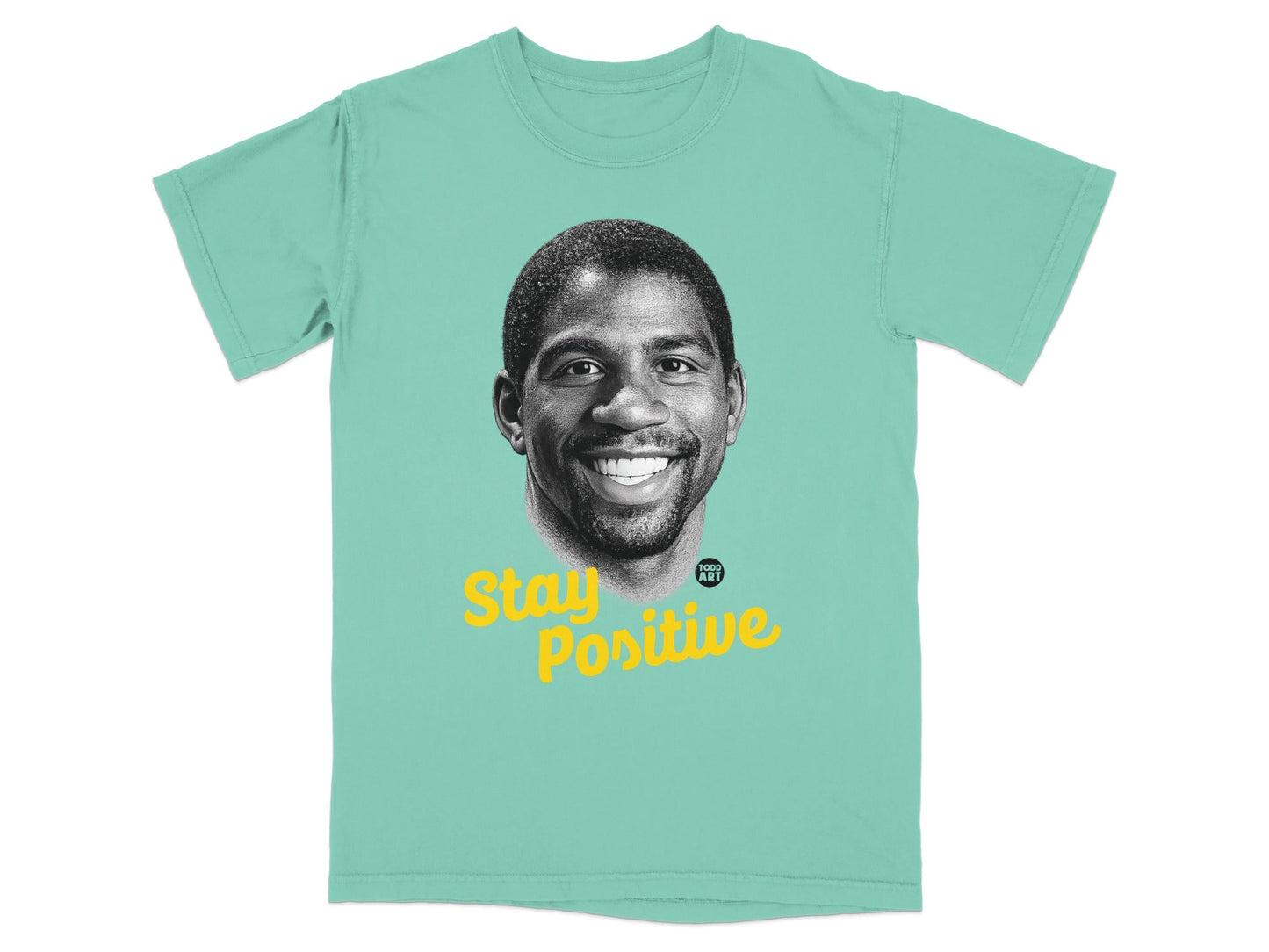 Turquoise t-shirt with Magic Johnson's portrait and "Stay Positive" text.