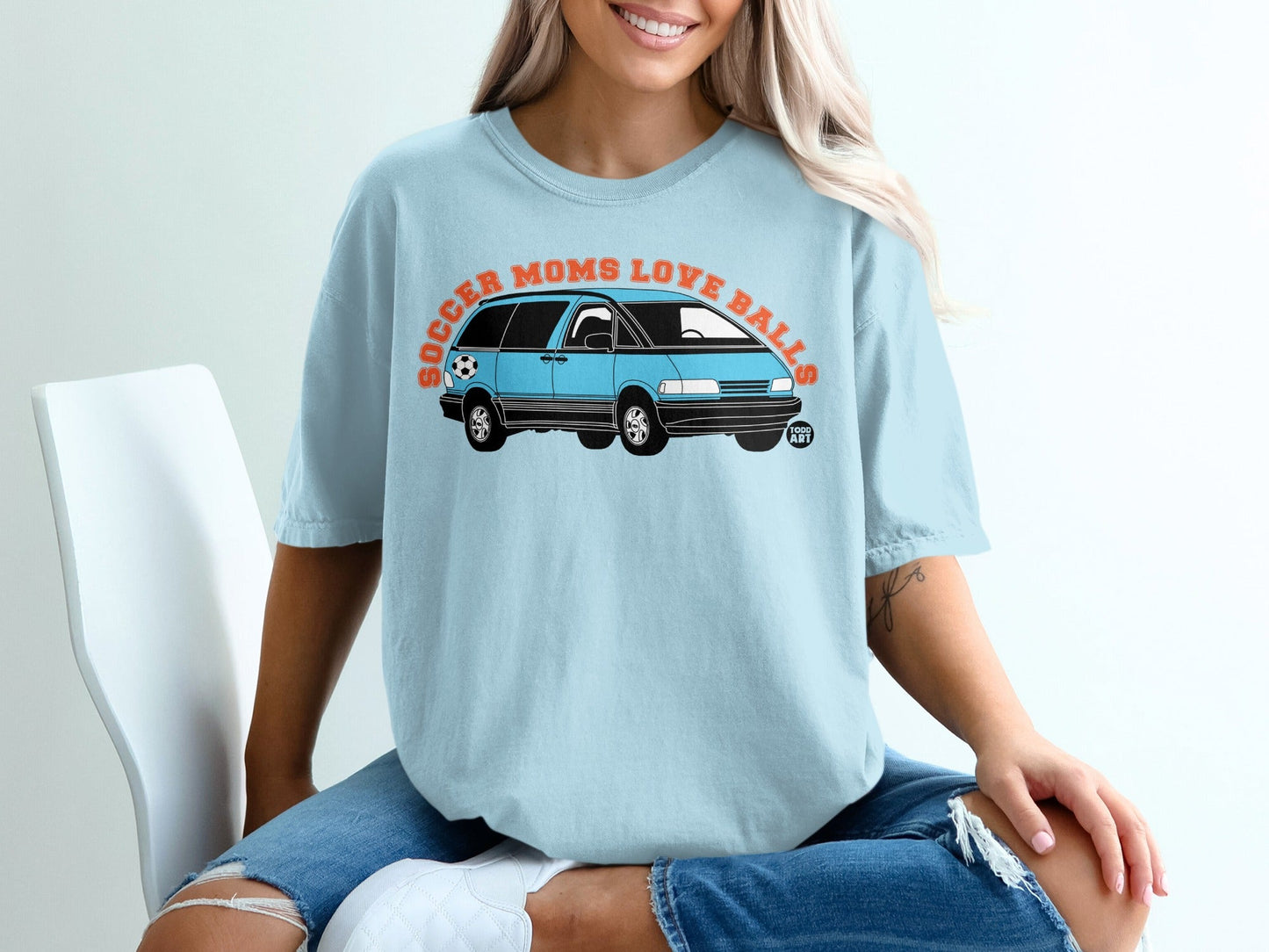 Light blue t-shirt with "Soccer Moms Love Balls" and a minivan graphic.