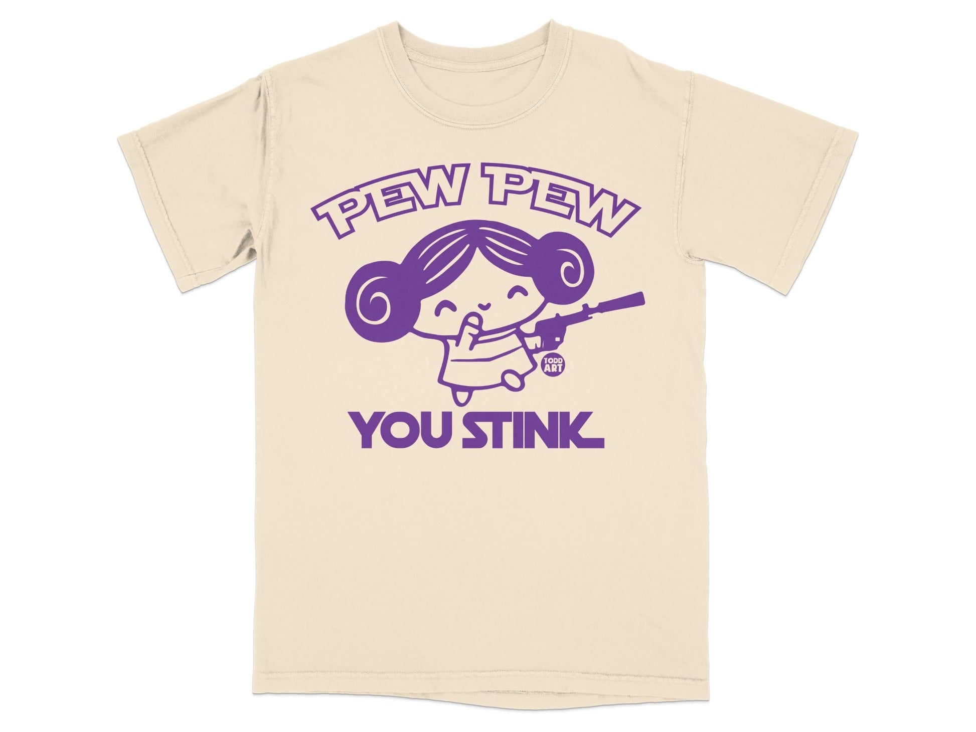 Cream t-shirt with purple graphic: cartoon girl holding a gun, text "PEW PEW YOU STINK".