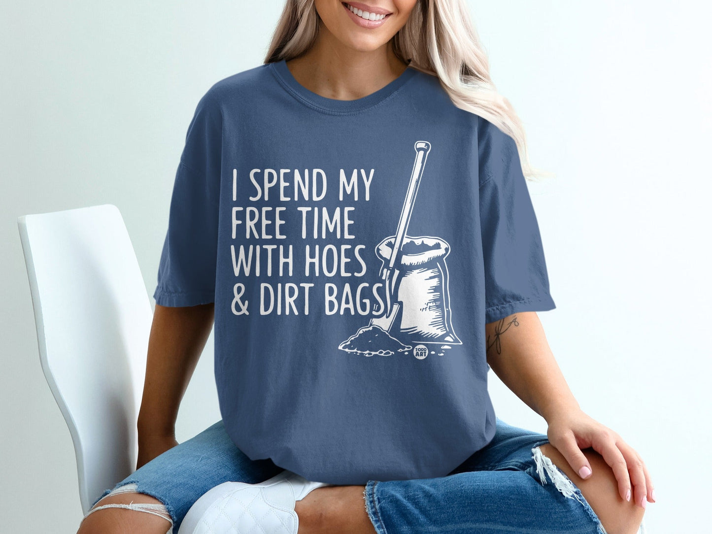 Blue t-shirt with white text and graphic: "I SPEND MY FREE TIME WITH HOES & DIRT BAGS".
