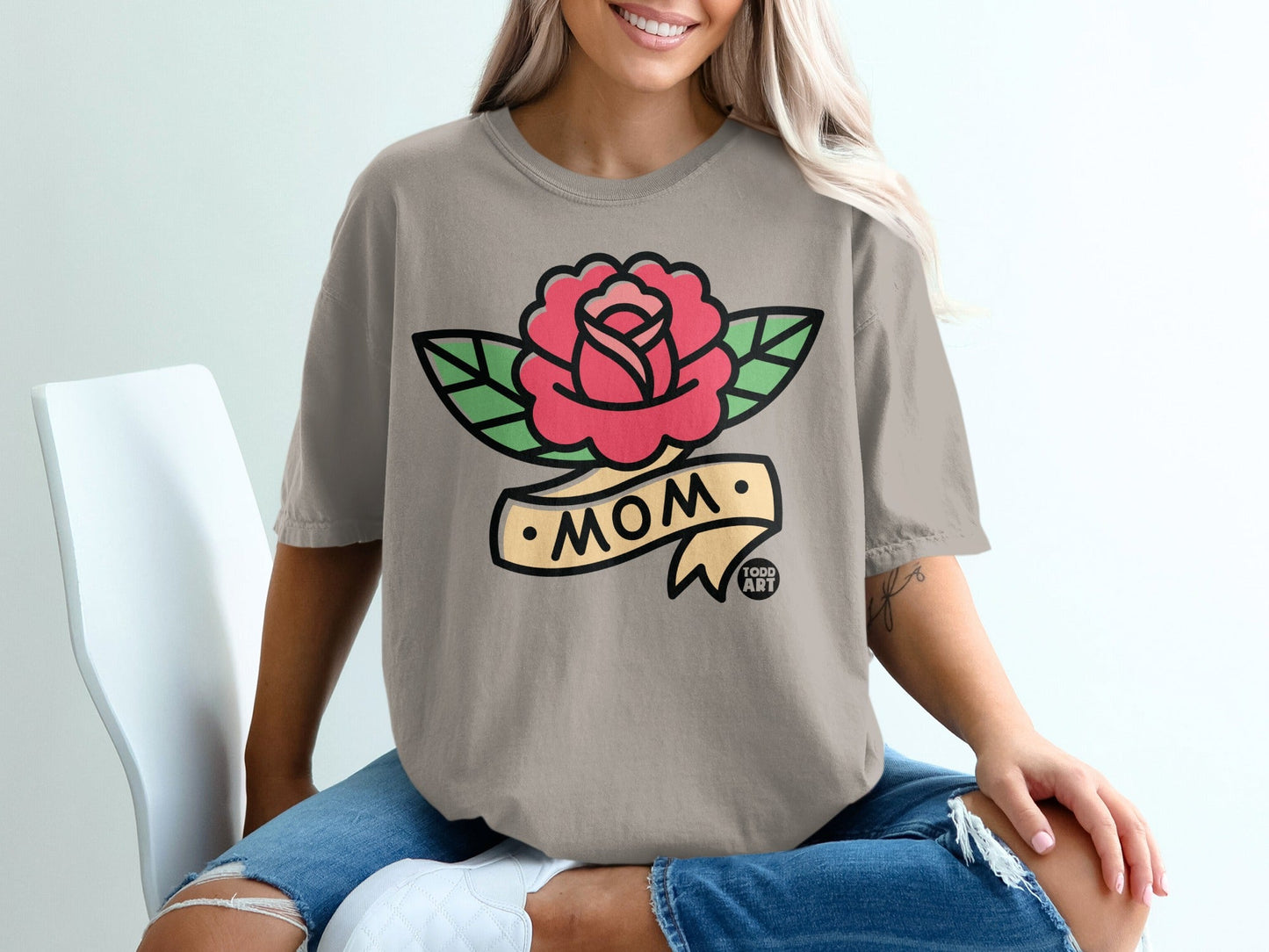 T-shirt with a red rose and "Mom" banner tattoo design.