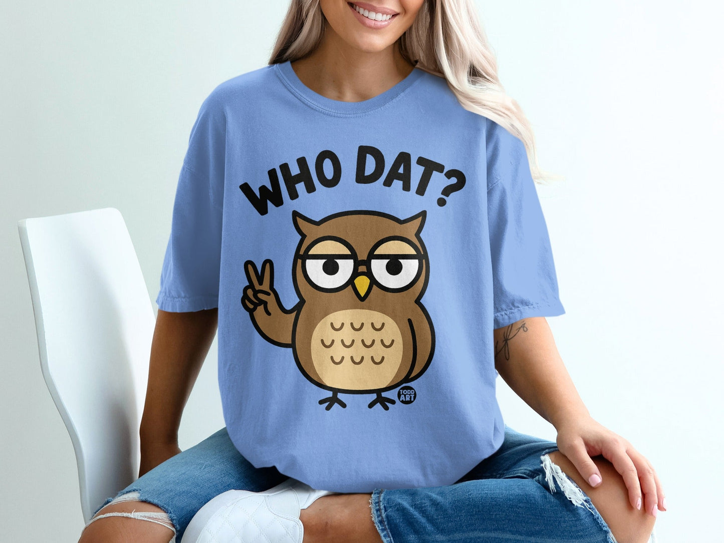 Blue t-shirt with cartoon owl and text "WHO DAT?".