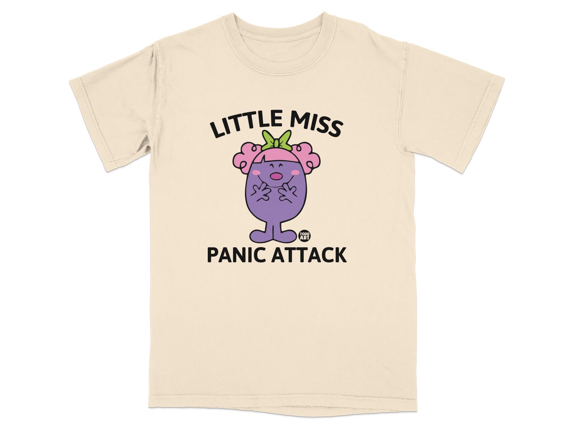 Cream t-shirt with "Little Miss PANIC ATTACK" and cartoon character.