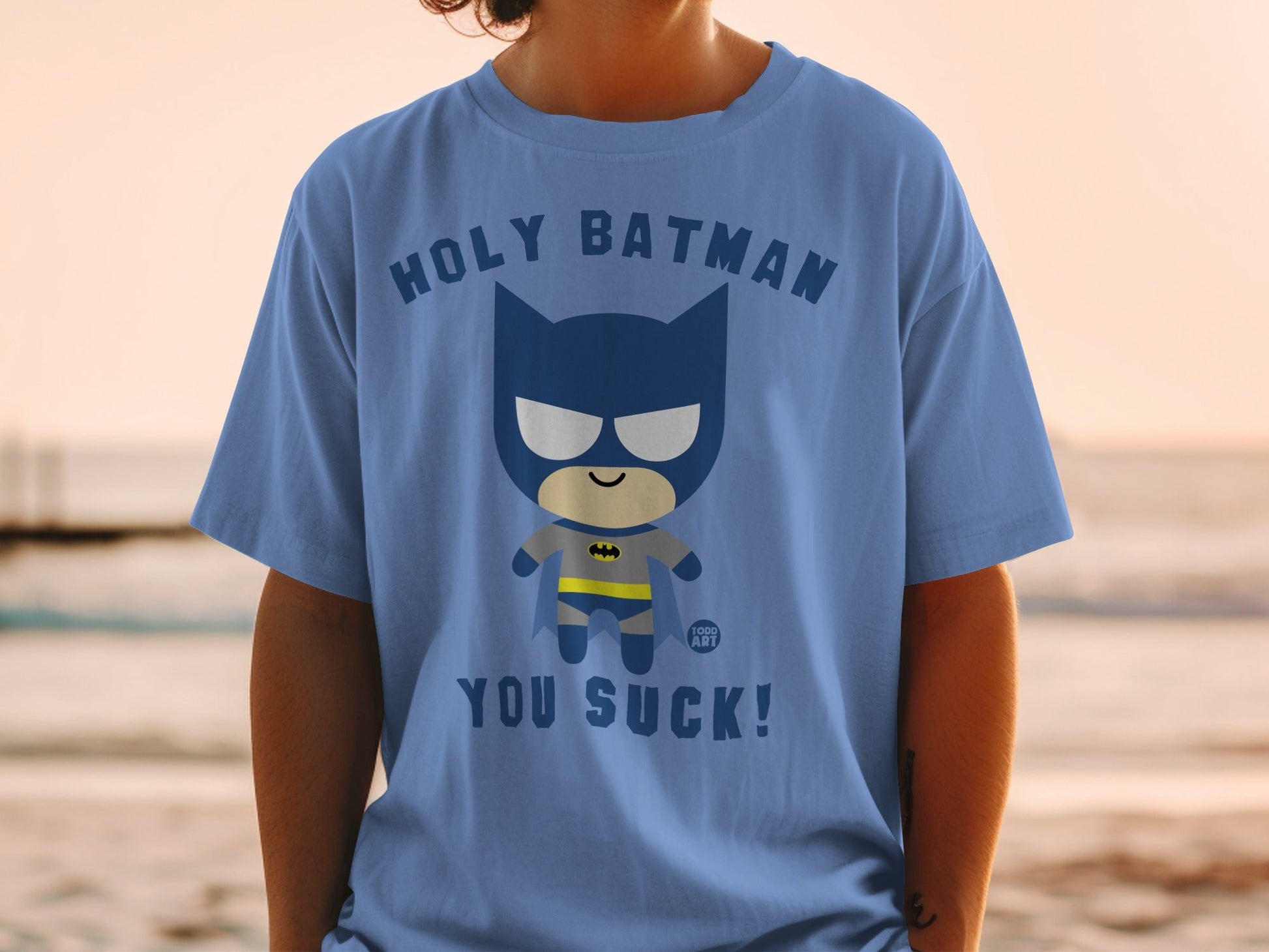 Blue t-shirt with chibi Batman saying "Holy Batman, You Suck!".