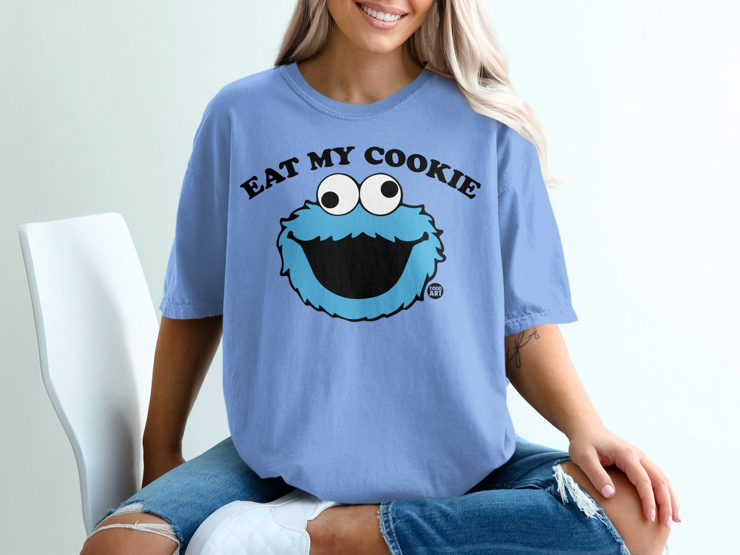 Blue t-shirt with Cookie Monster saying "Eat My Cookie".