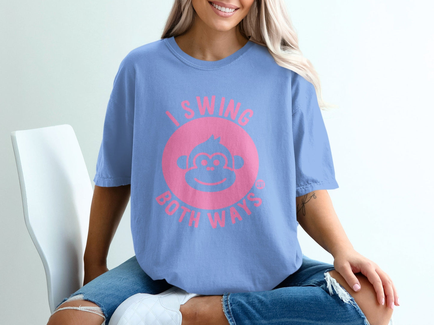 Blue t-shirt with pink text and monkey graphic reading "I Swing Both Ways".