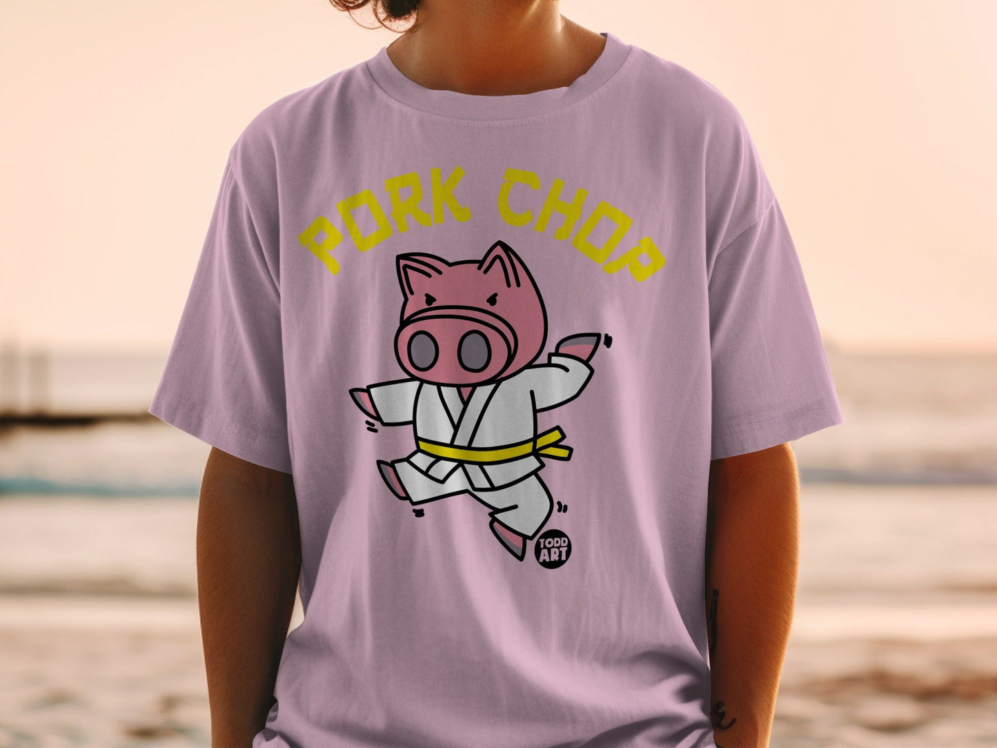 Cartoon pig in a karate gi with "PORK CHOP" text.
