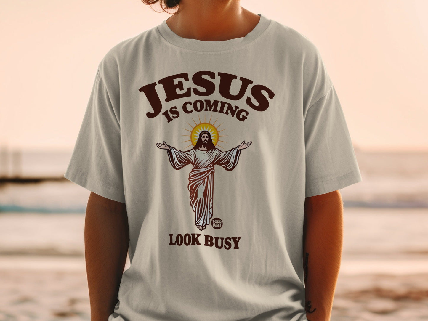 T-shirt with Jesus graphic and "Jesus is Coming, Look Busy" text.