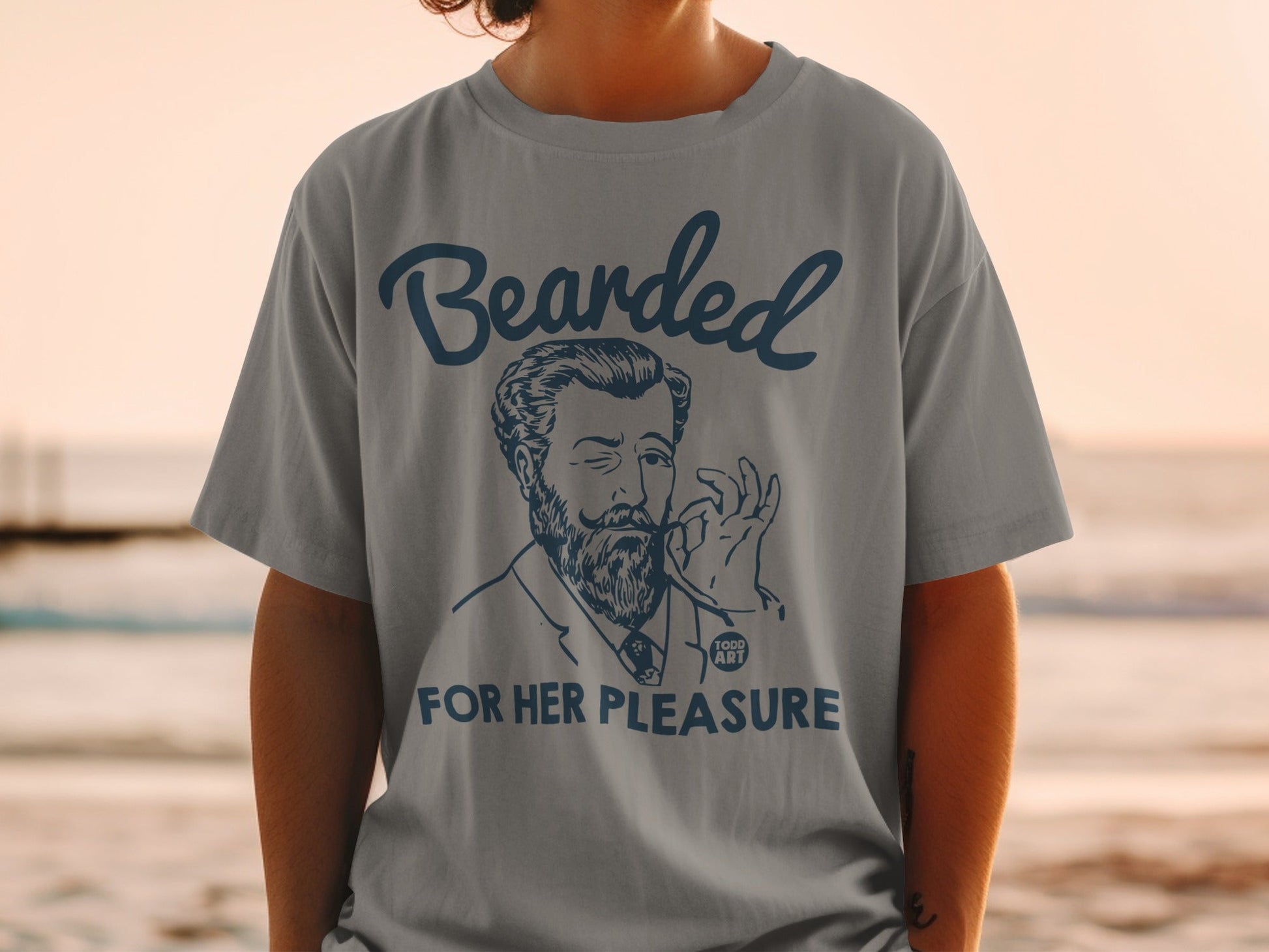 T-shirt with "Bearded for Her Pleasure" and a man with a beard and pipe.