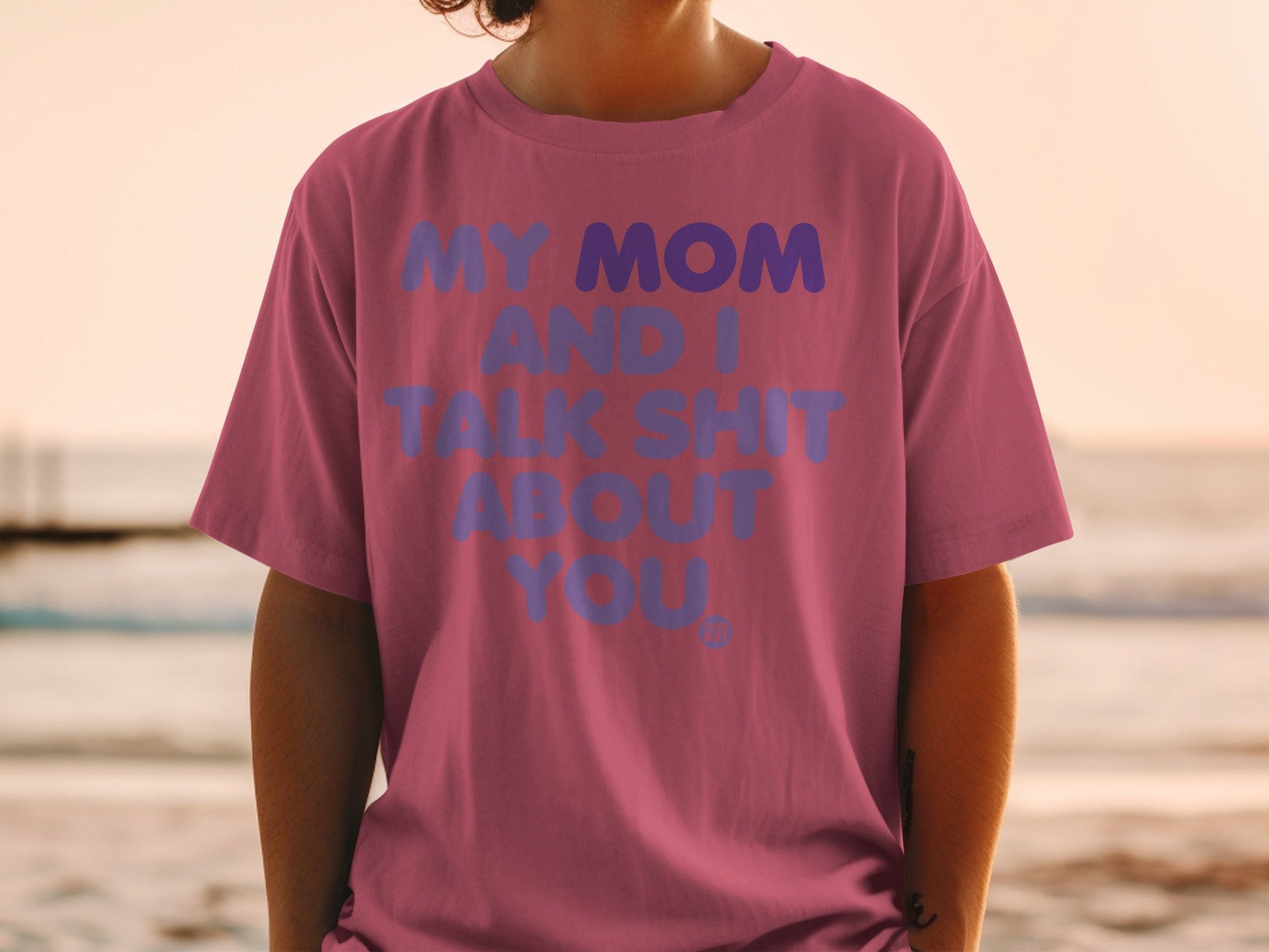 Pink t-shirt with "MY MOM AND I TALK SHIT ABOUT YOU" text.