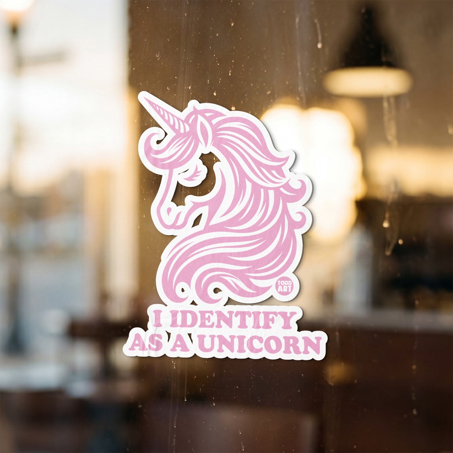 Pink unicorn sticker with text "I IDENTIFY AS A UNICORN".