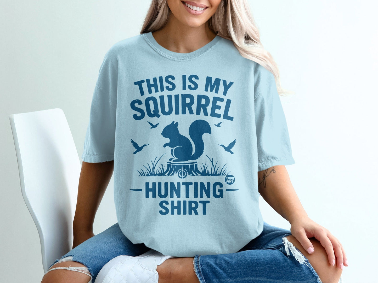 Light blue t-shirt with "This is my squirrel hunting shirt" text and graphics.