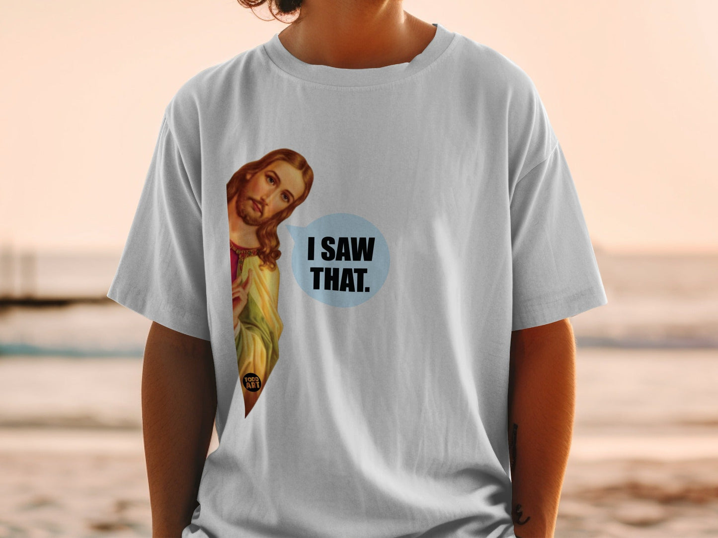 T-shirt with Jesus peeking from the side, saying "I SAW THAT."