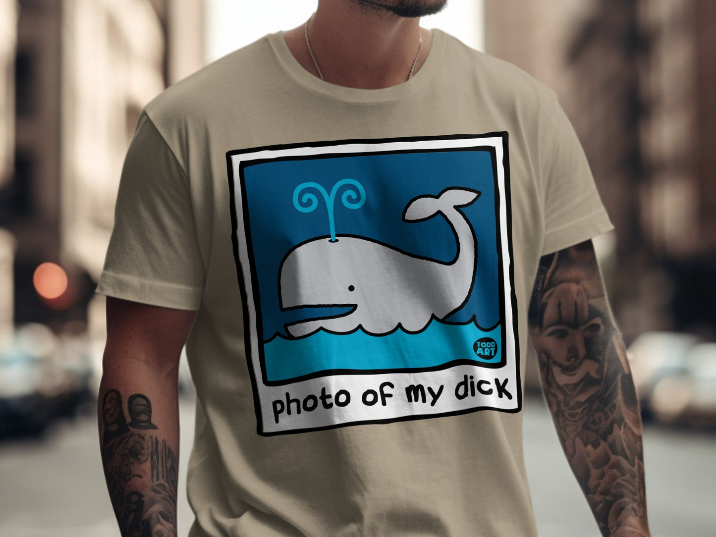 T-shirt with cartoon whale illustration and "photo of my dick" text.