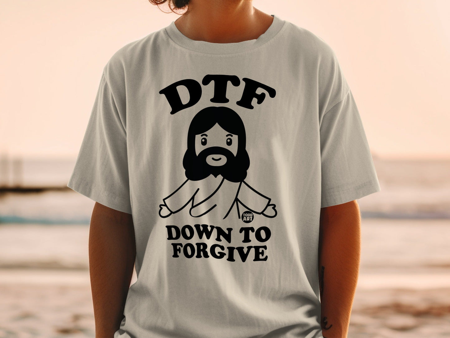 DTF Down to Forgive graphic t-shirt with cartoon Jesus.