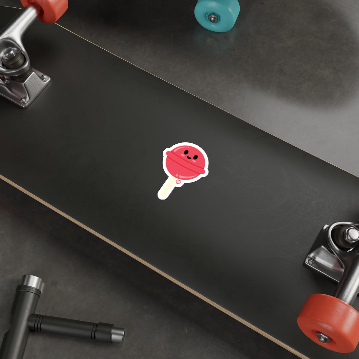 Cute Red Lollipop Sticker on Black Skateboard Deck
