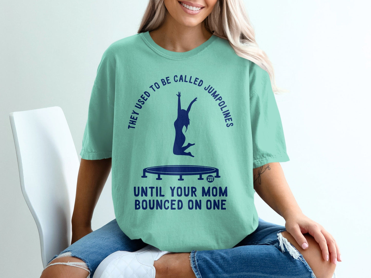 Teal t-shirt with "They Used to Be Called Jumpolines Until Your Mom Bounced On One" graphic.