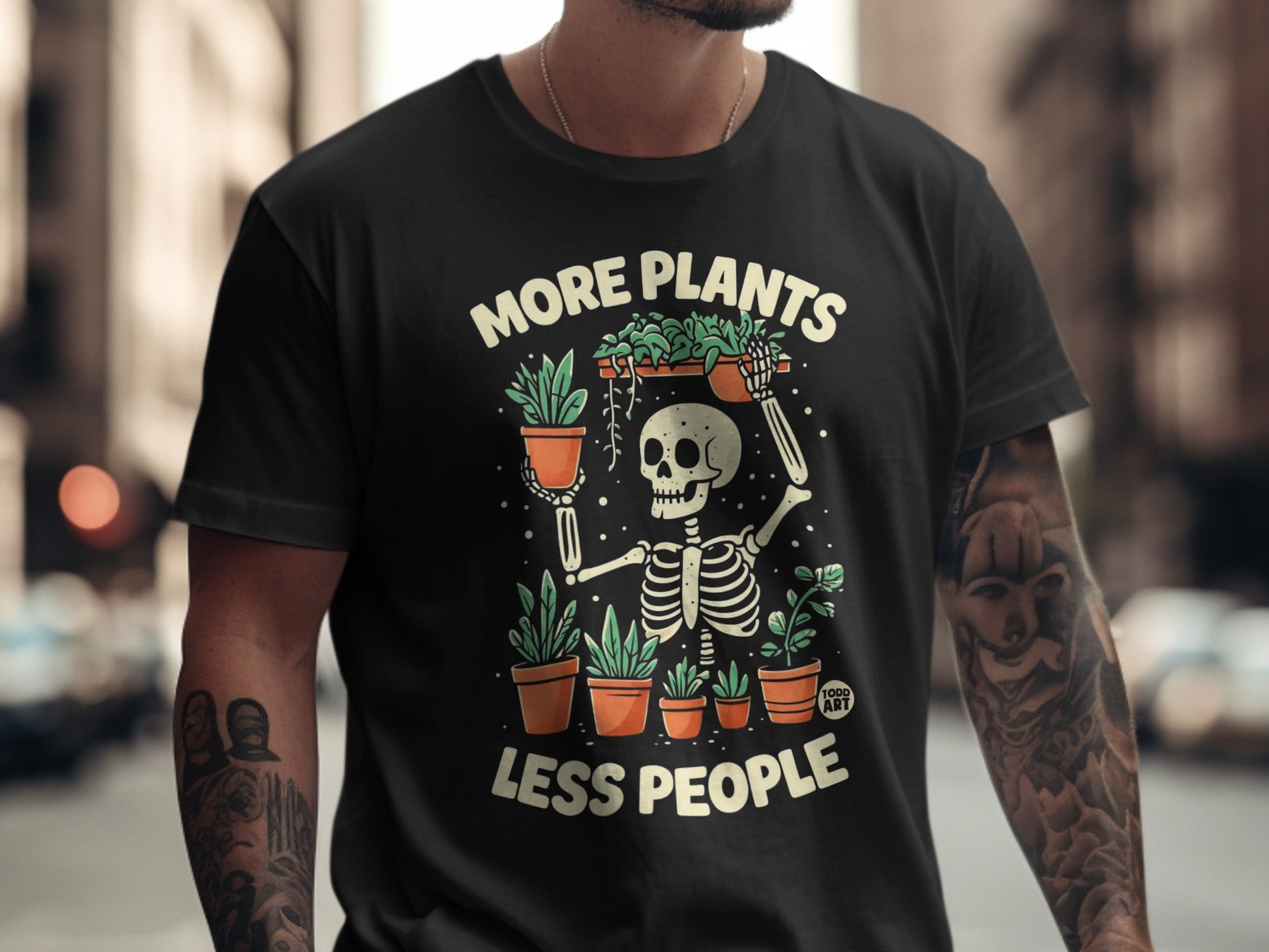 Skeleton graphic t-shirt with text "More Plants, Less People" and potted plants.